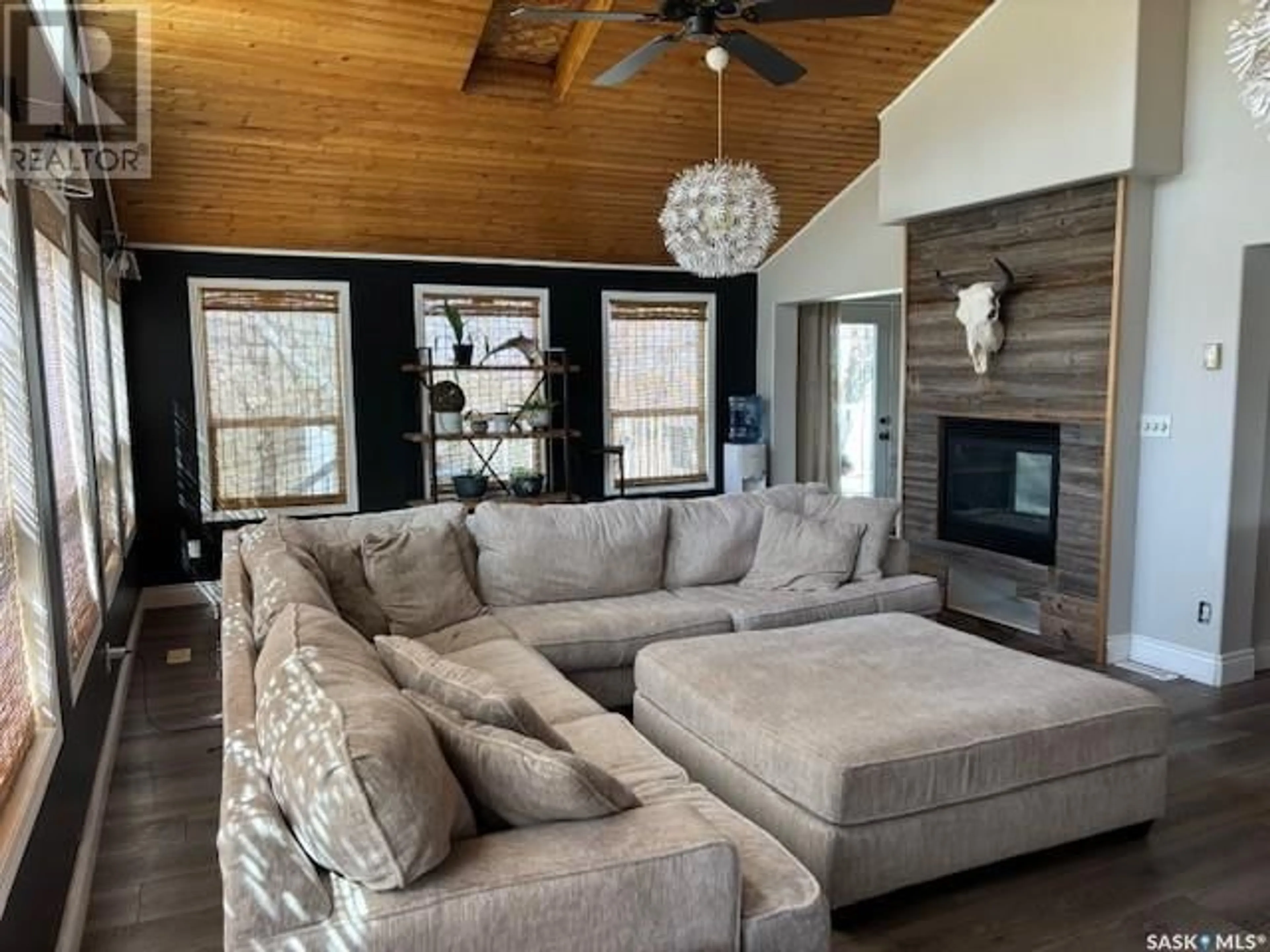Living room with furniture, wood/laminate floor for 212 RAILWAY AVENUE, Amsterdam Saskatchewan S0A0L0