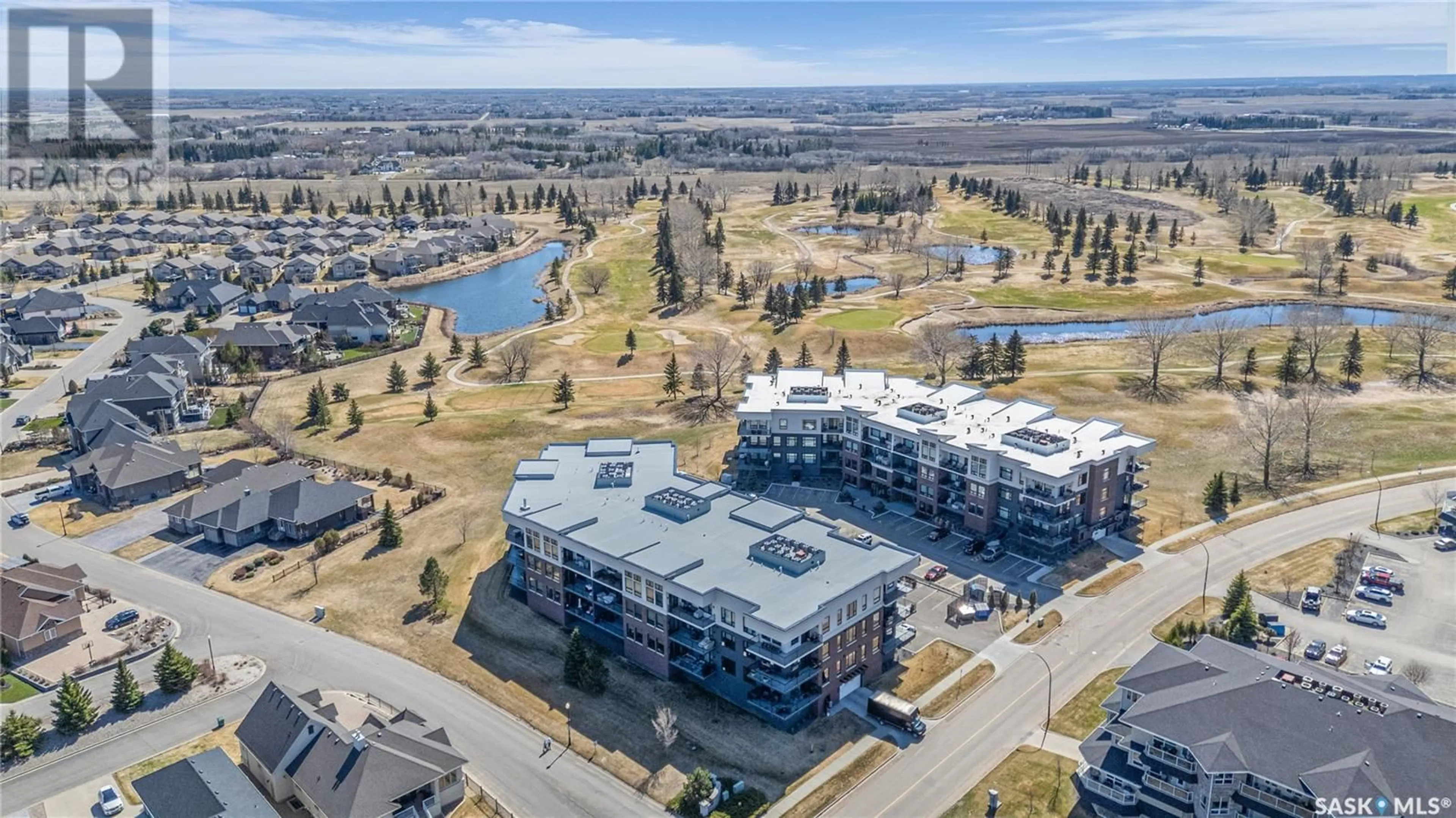 A pic from outside/outdoor area/front of a property/back of a property/a pic from drone, water/lake/river/ocean view for 210 408 CARTWRIGHT STREET, Saskatoon Saskatchewan S7T0X1