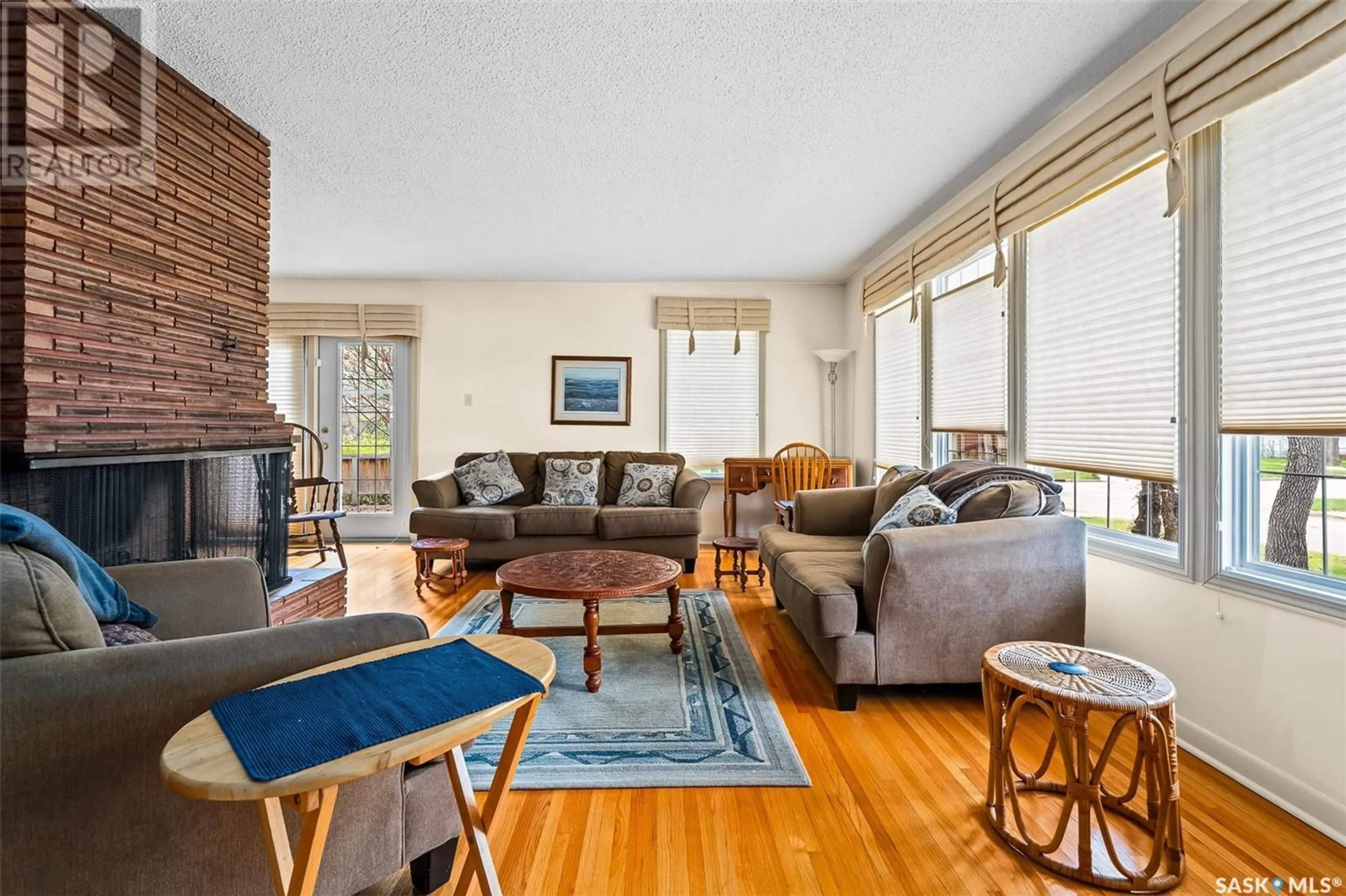Living room with furniture, wood/laminate floor for 1011 3RD AVENUE, Moose Jaw Saskatchewan S6H1E6