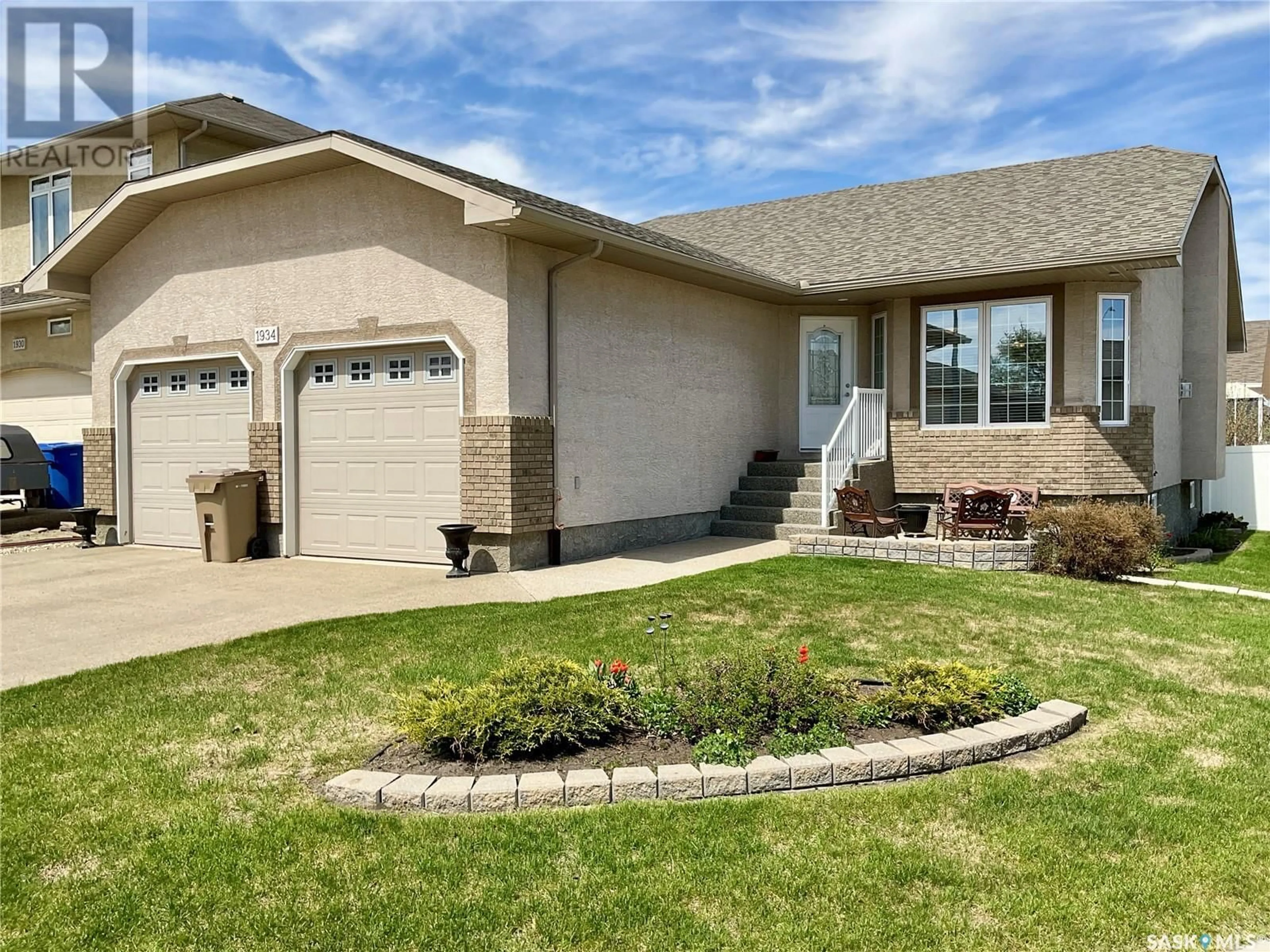 Home with brick exterior material, street for 1934 DUNNISON CRESCENT, Regina Saskatchewan S4V0N8
