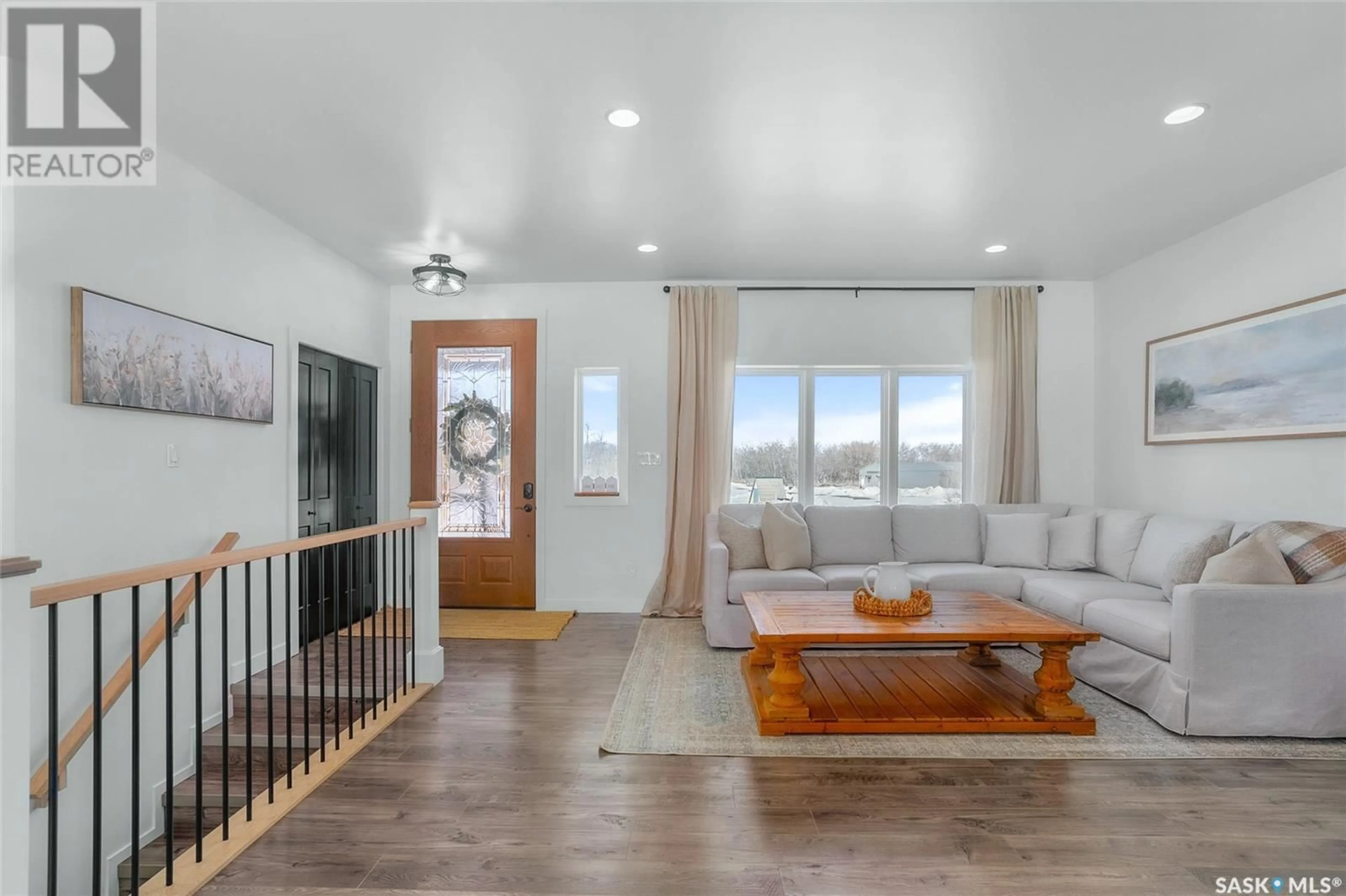 Living room with furniture, wood/laminate floor for Acre - 22 O'MALLEY ROAD, Montrose Rm No. 315 Saskatchewan S0L0P0