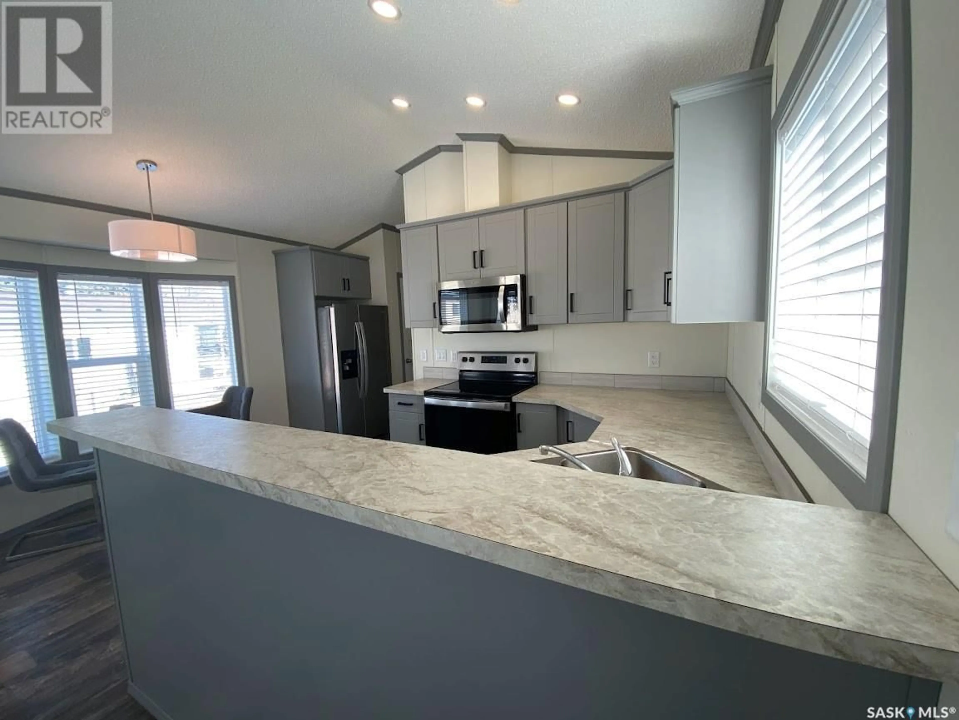 Open concept kitchen, ceramic/tile floor for 79 MULBERRY ROAD, Sunset Estates Saskatchewan S7B0A4