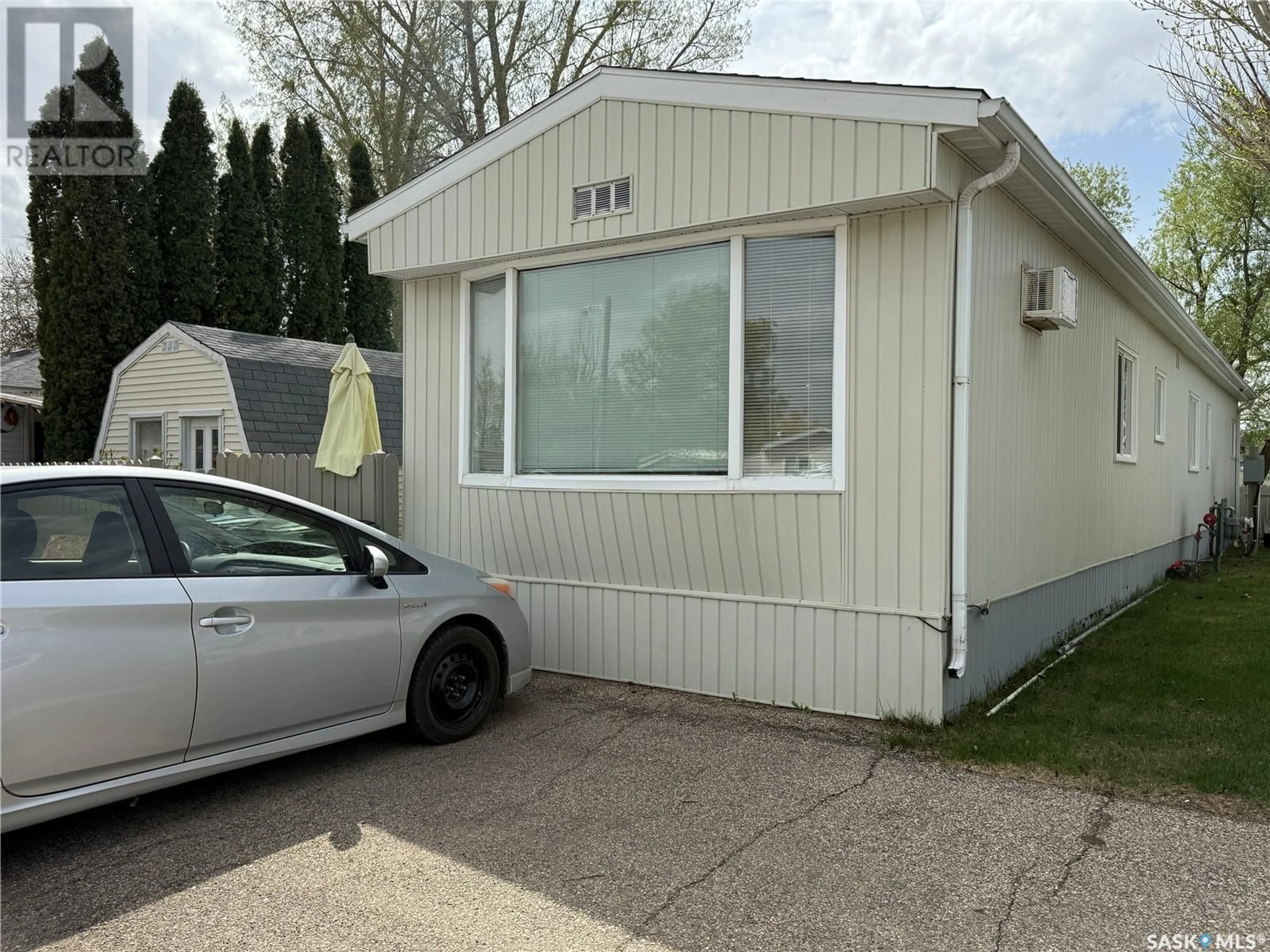 Home with vinyl exterior material, street for B4 - 1455 9TH AVENUE, Moose Jaw Saskatchewan S6J1C6