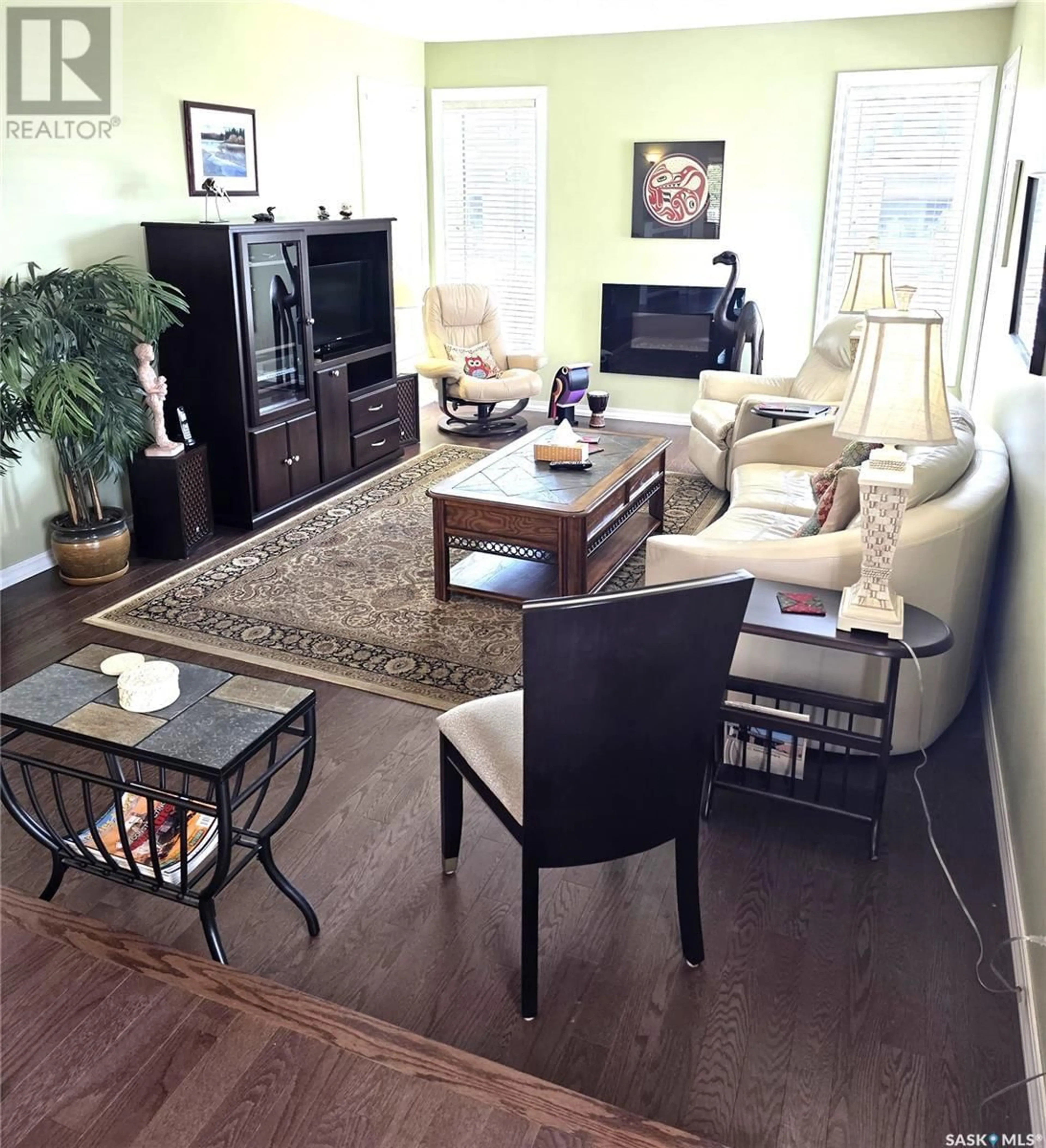 Living room with furniture, wood/laminate floor for 251 GIRGULIS COURT, Saskatoon Saskatchewan S7K6X1