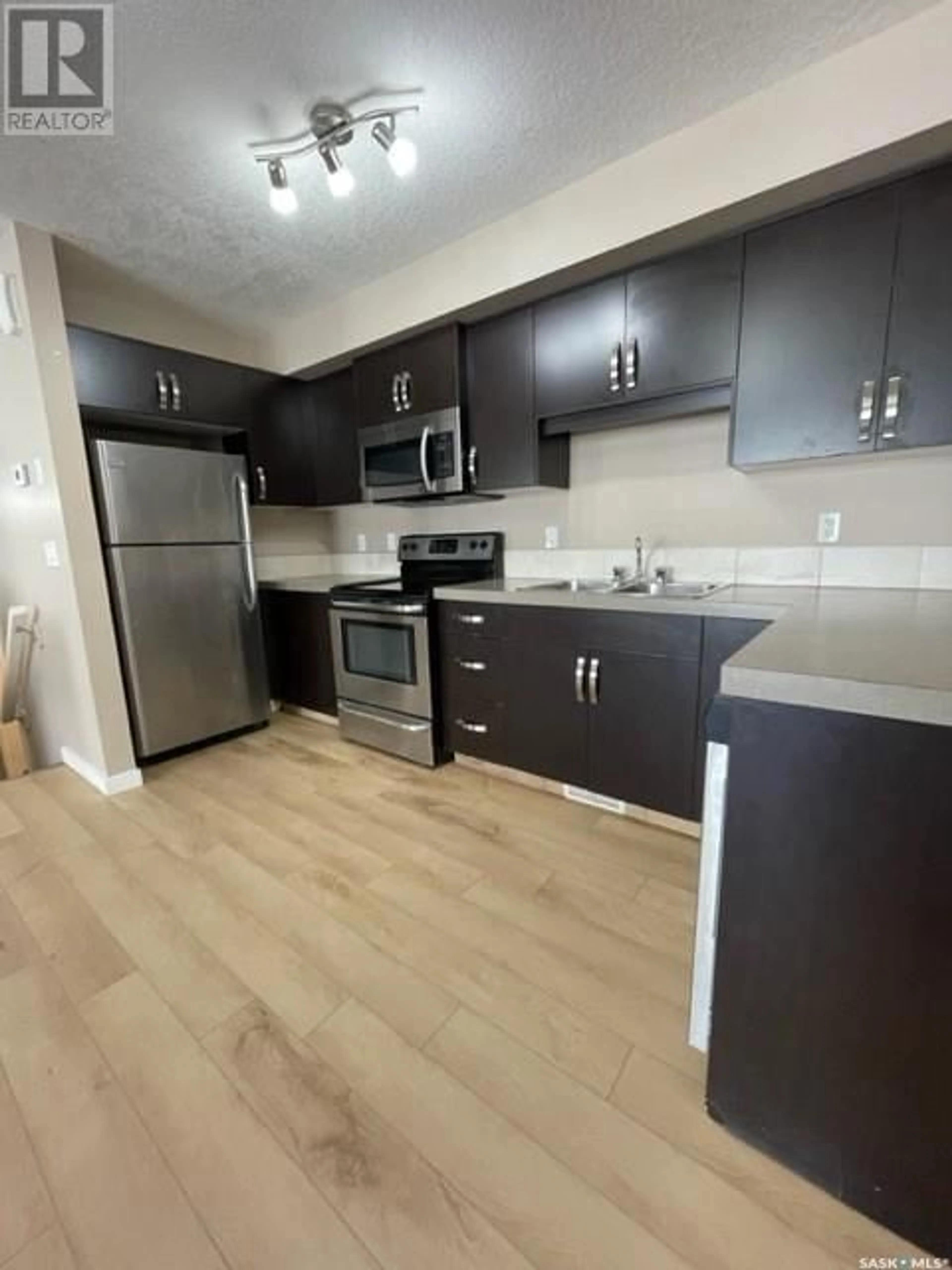 Standard kitchen, wood/laminate floor for 5242 - 61 AERODROME ROAD, Regina Saskatchewan S4W0H7