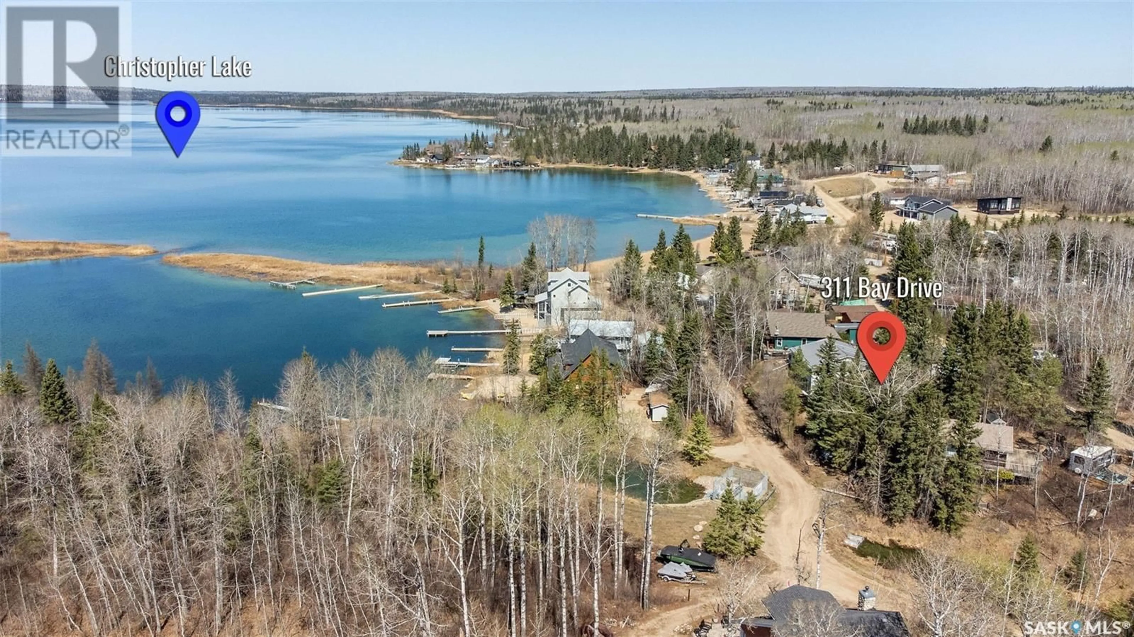 A pic from outside/outdoor area/front of a property/back of a property/a pic from drone, water/lake/river/ocean view for 311 BAY DRIVE, Christopher Lake Saskatchewan S0J0N0