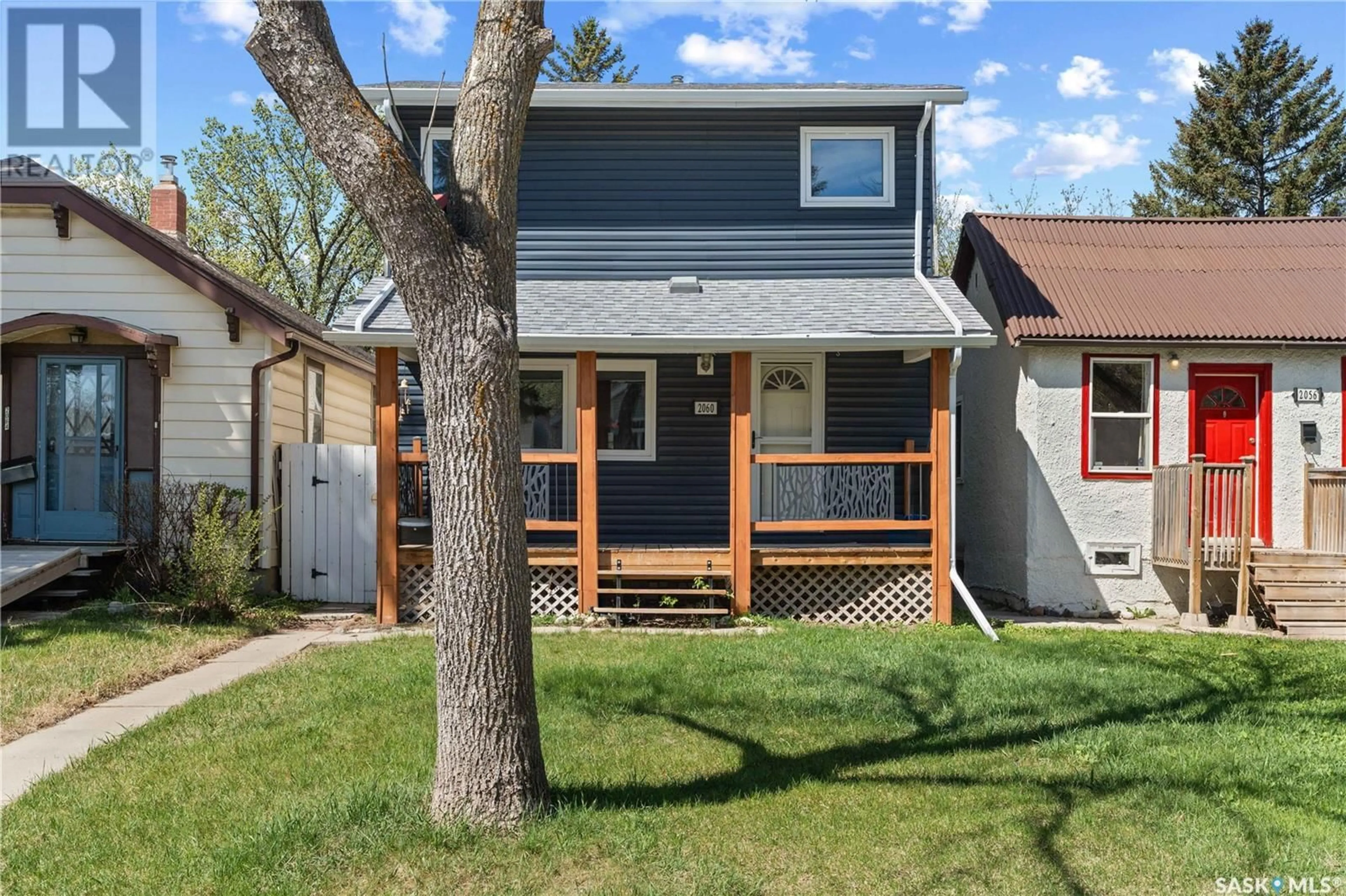 Home with vinyl exterior material, street for 2060 QUEEN STREET, Regina Saskatchewan S4T4C1