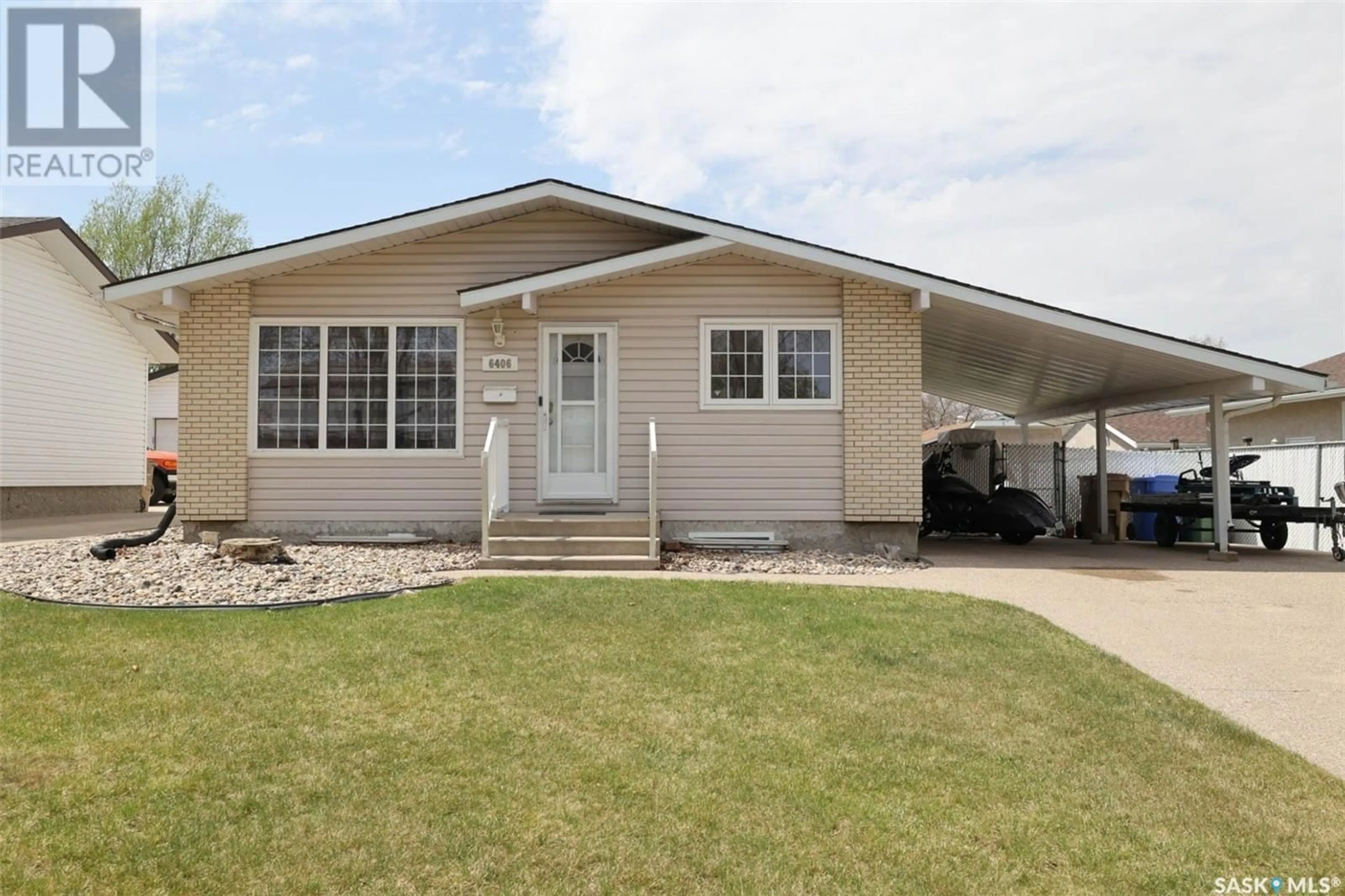 Home with vinyl exterior material, street for 6406 7TH AVENUE, Regina Saskatchewan S4T7K7