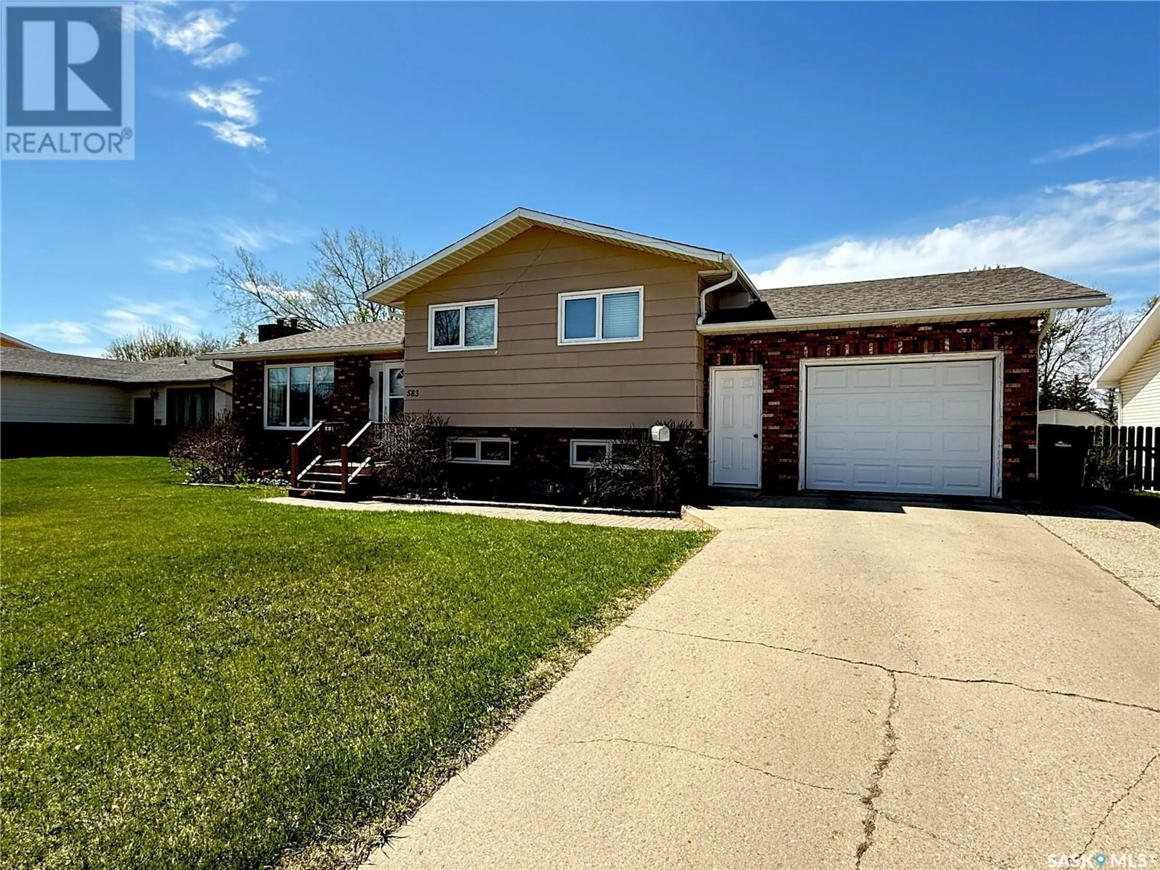 Home with vinyl exterior material, street for 583 13TH STREET, Weyburn Saskatchewan S4H2Y4