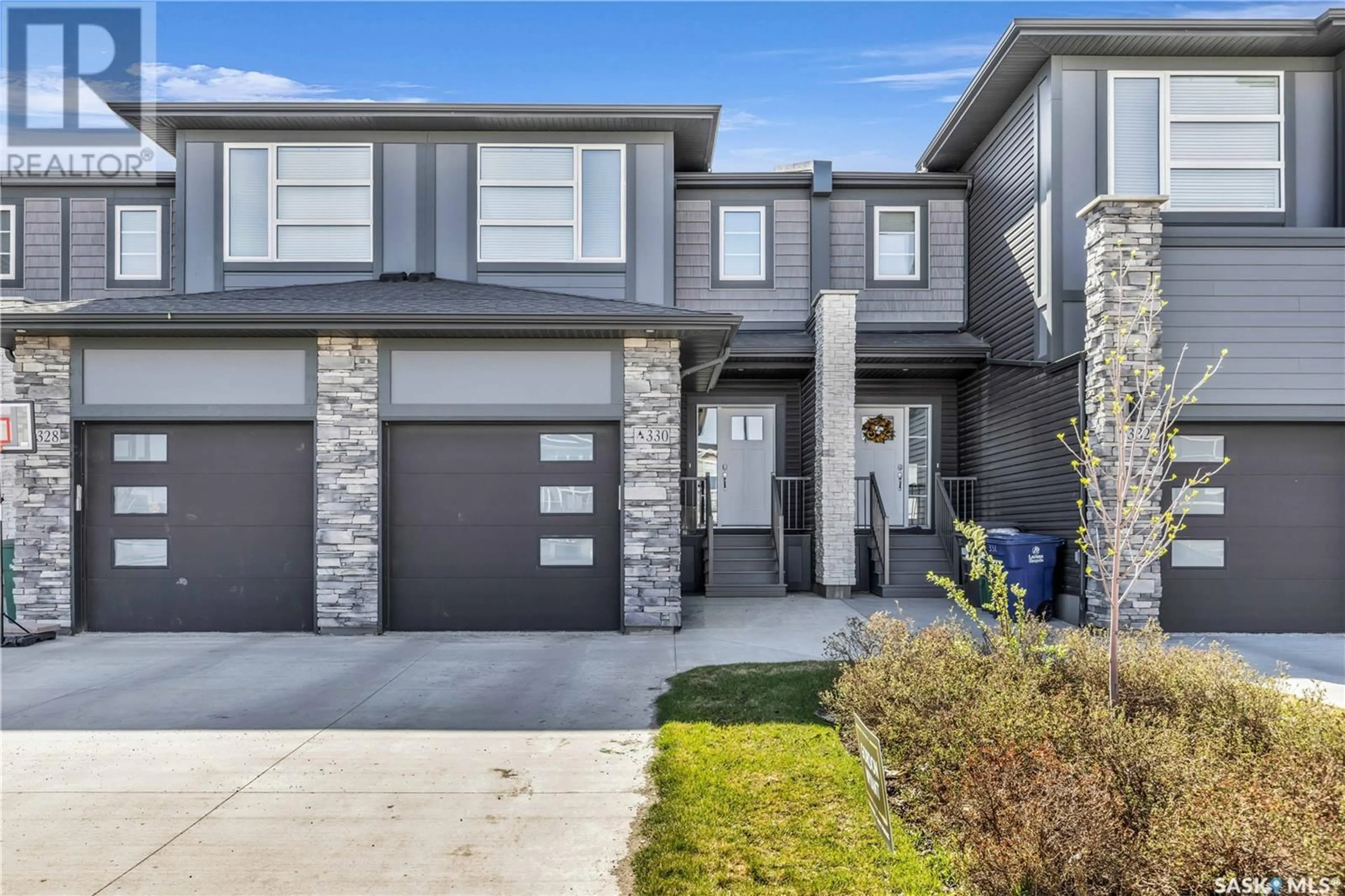 Home with brick exterior material, street for 330 BRIGHTON GATE, Saskatoon Saskatchewan S7V0V5