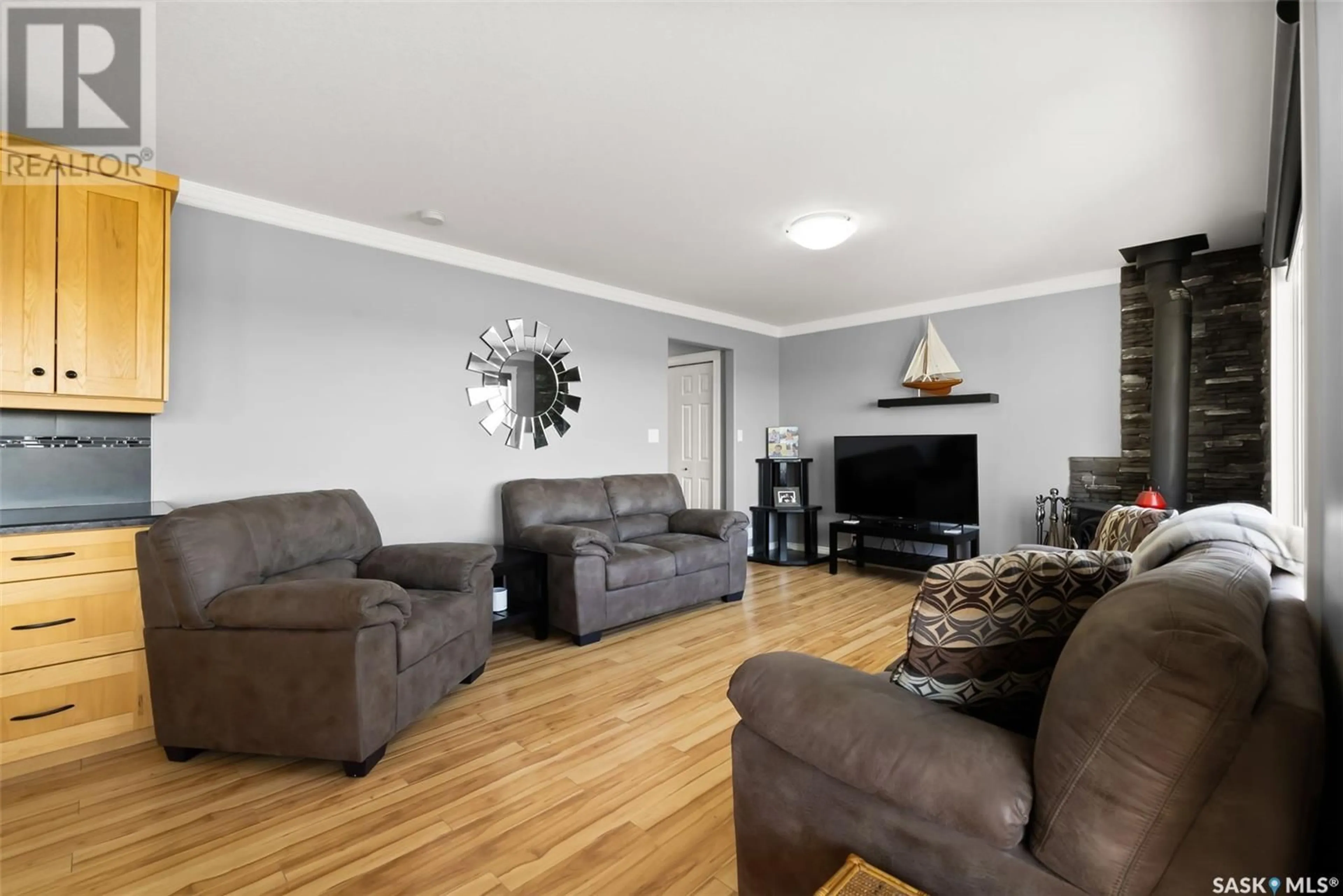 Living room with furniture, wood/laminate floor for 224 PICKEREL STREET, Mckillop Rm No. 220 Saskatchewan S0G4L0