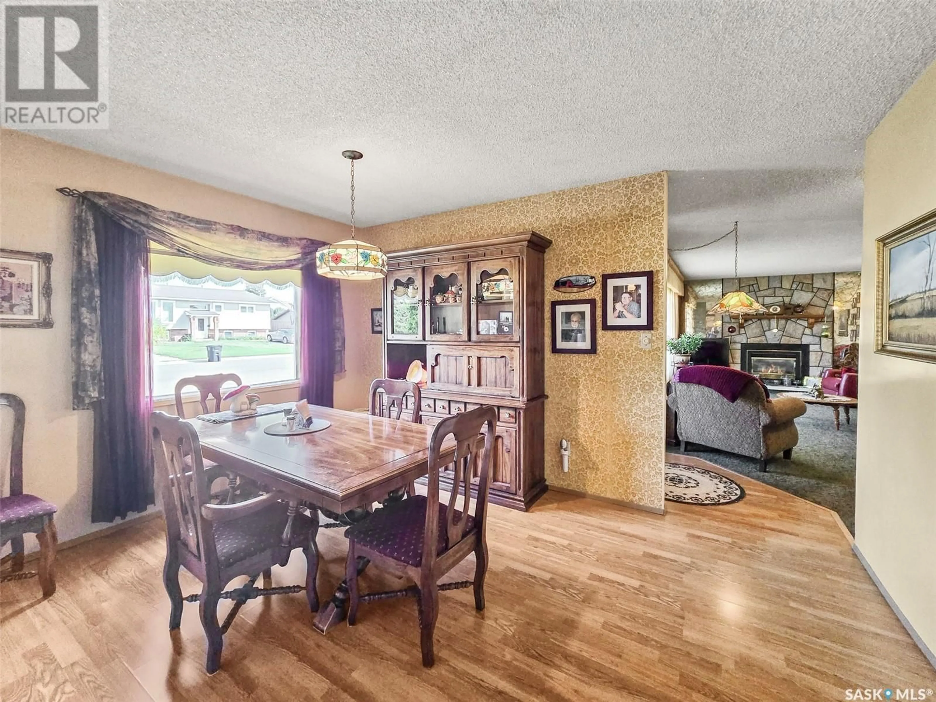Dining room, wood/laminate floor for 408 8TH AVENUE, Biggar Saskatchewan S0K0M0