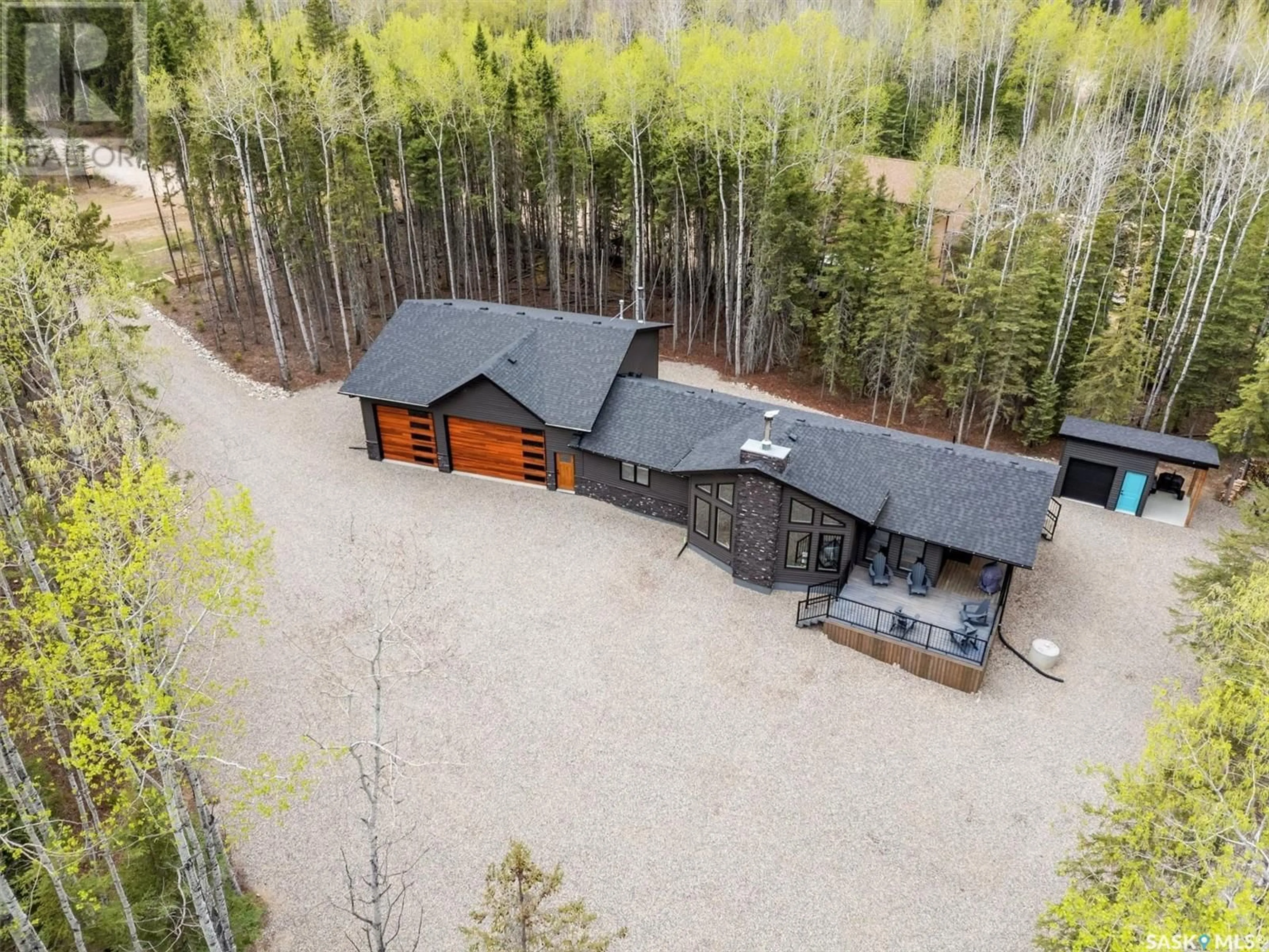 A pic from outside/outdoor area/front of a property/back of a property/a pic from drone, forest/trees view for 306 MEADOW RIDGE DRIVE, Candle Lake Saskatchewan S0J3E0