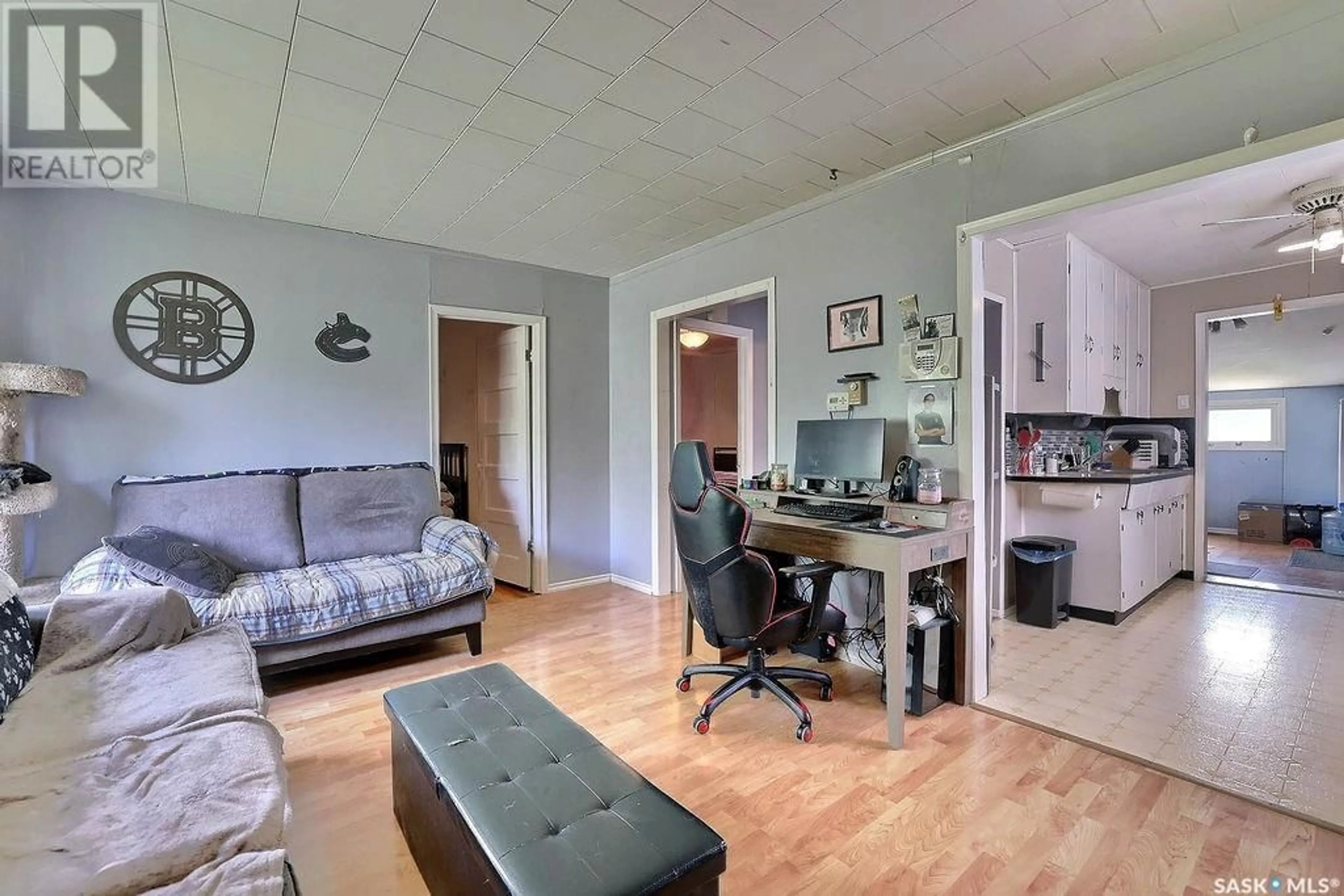 Living room with furniture, wood/laminate floor for 647 KING STREET, Regina Saskatchewan S4T4C8