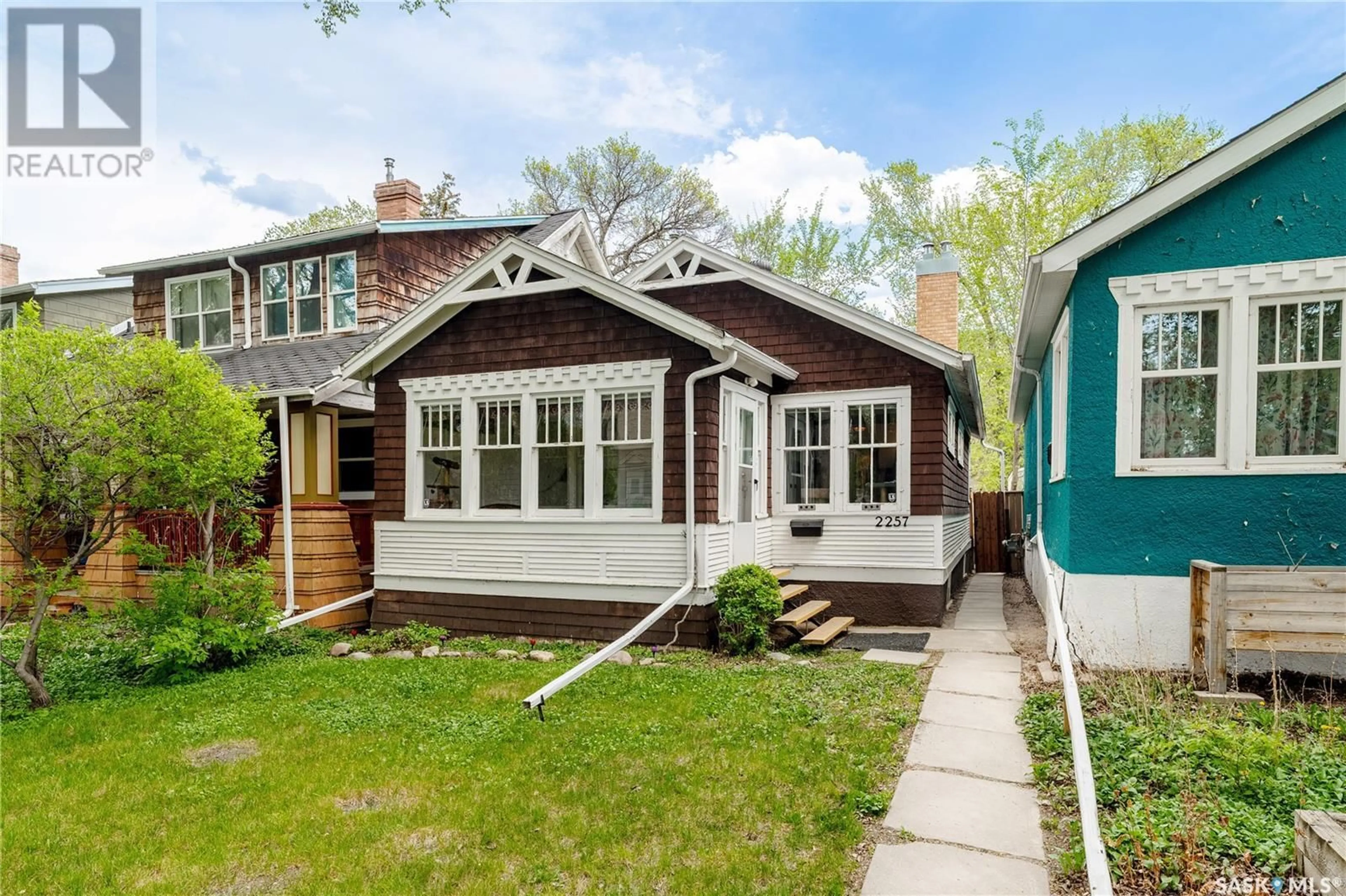 Home with vinyl exterior material, street for 2257 MONTREAL STREET, Regina Saskatchewan S4P1L7