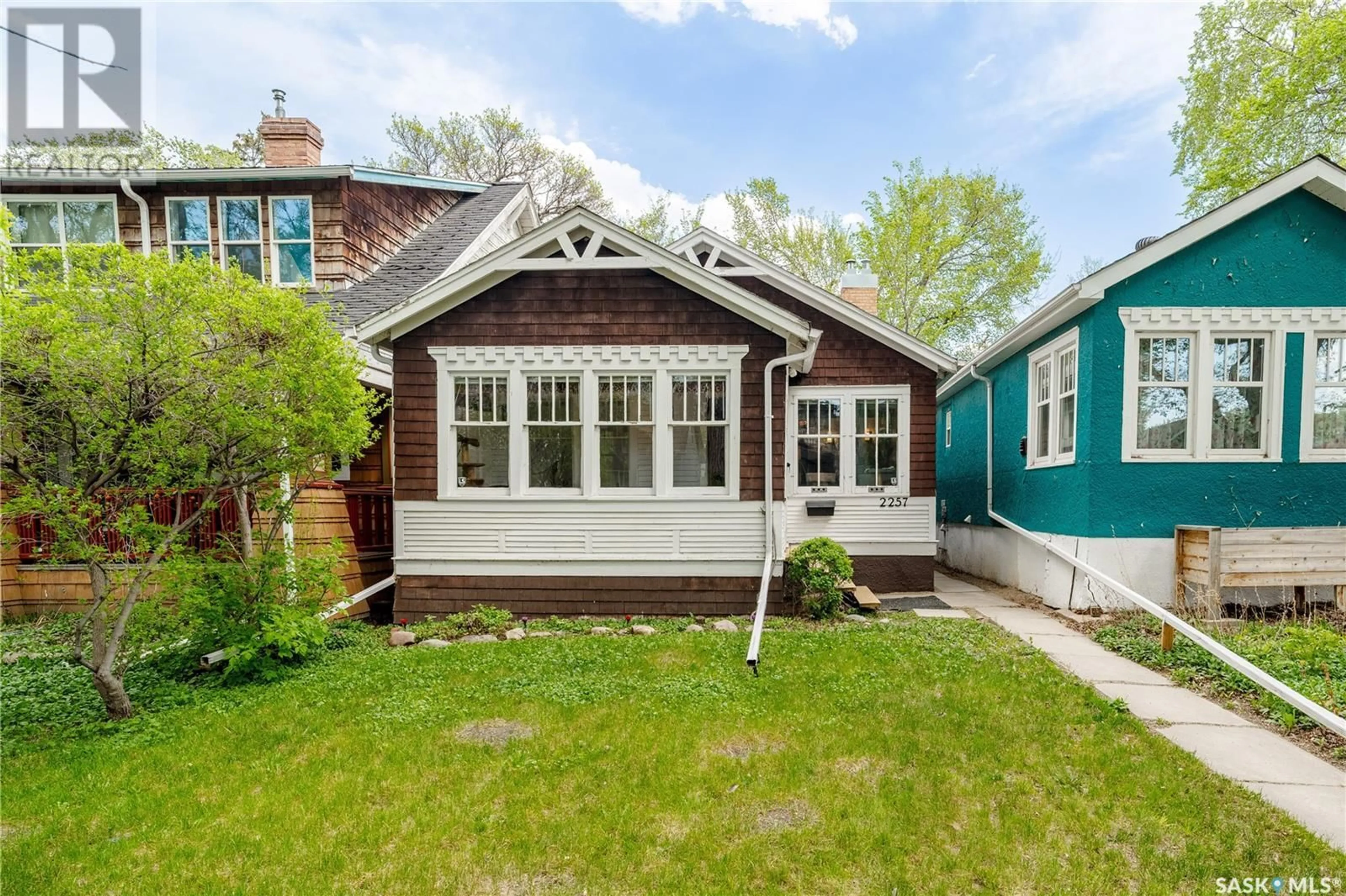 Home with vinyl exterior material, street for 2257 MONTREAL STREET, Regina Saskatchewan S4P1L7