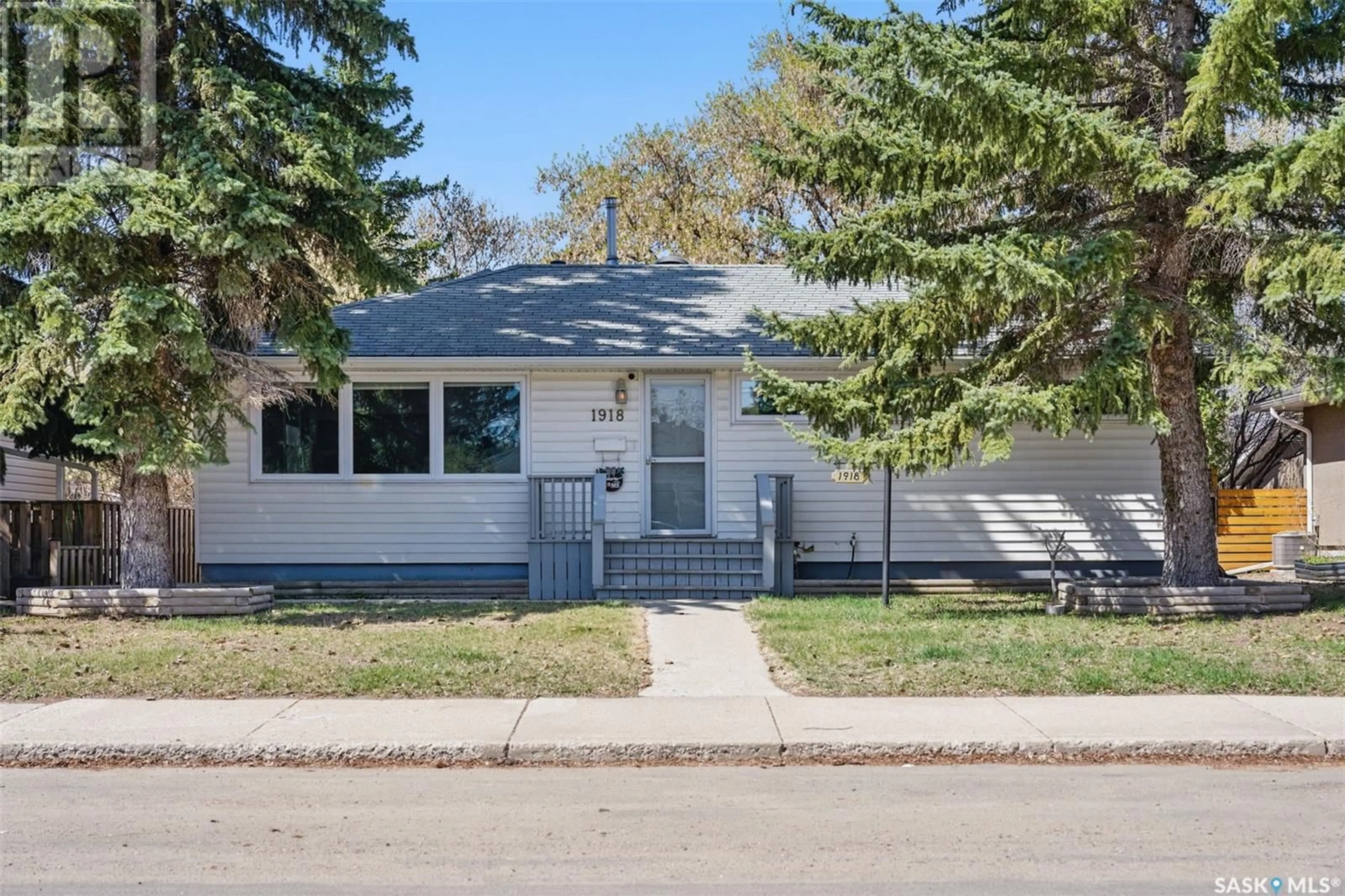 Home with vinyl exterior material, street for S - 1918 WIGGINS AVENUE, Saskatoon Saskatchewan S7J1W3