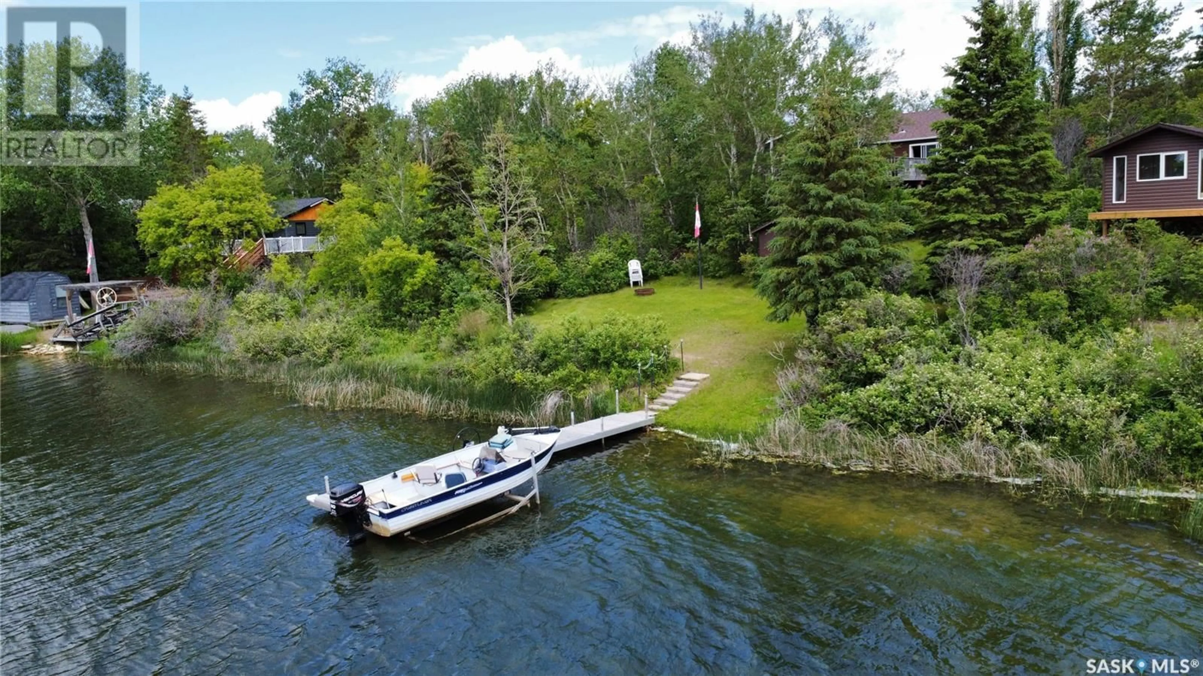 A pic from outside/outdoor area/front of a property/back of a property/a pic from drone, water/lake/river/ocean view for 5714 NELSON BEACH, Wakaw Lake Saskatchewan S0K4P0