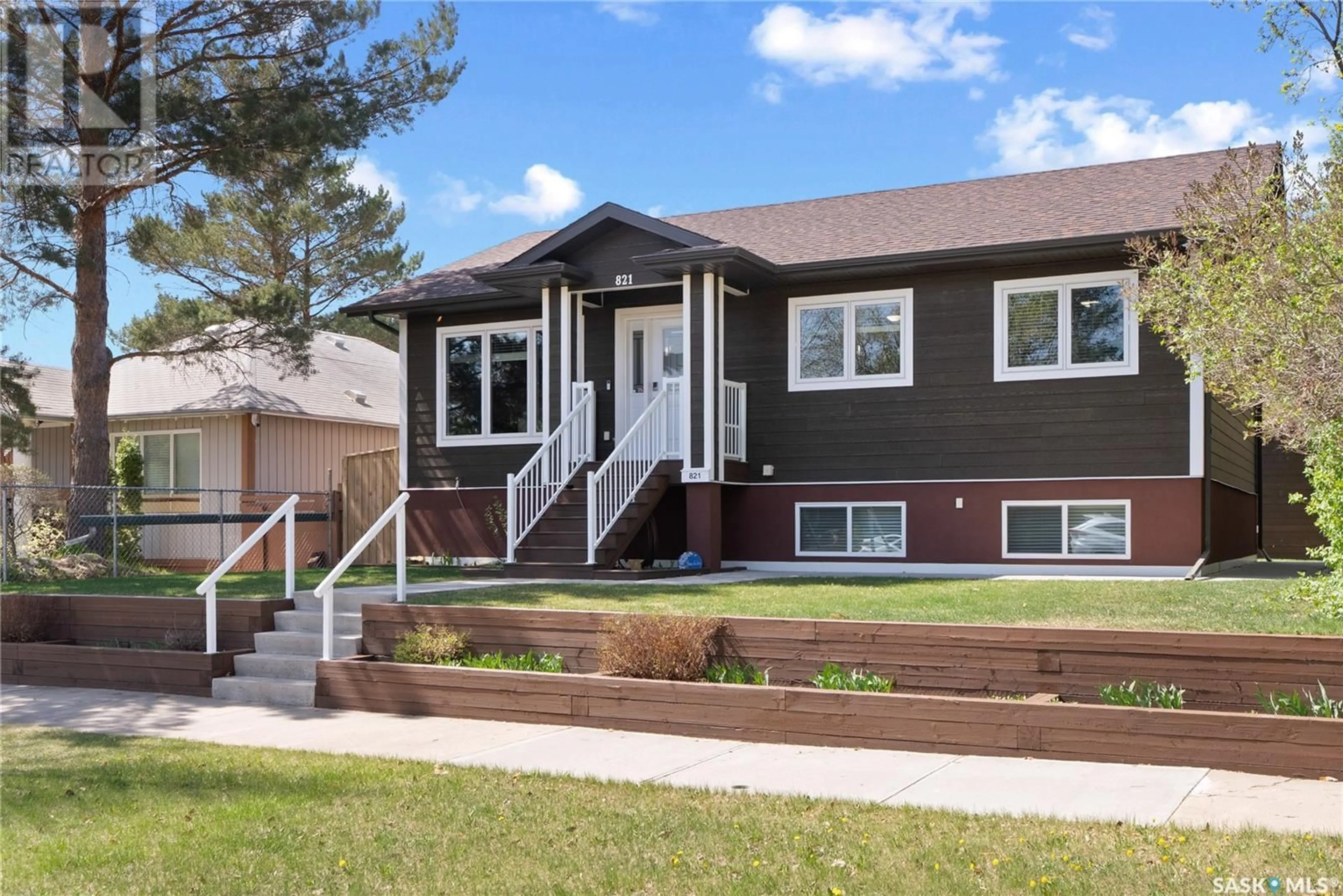 Home with vinyl exterior material, street for 821 100TH STREET, North Battleford Saskatchewan S9A0T8