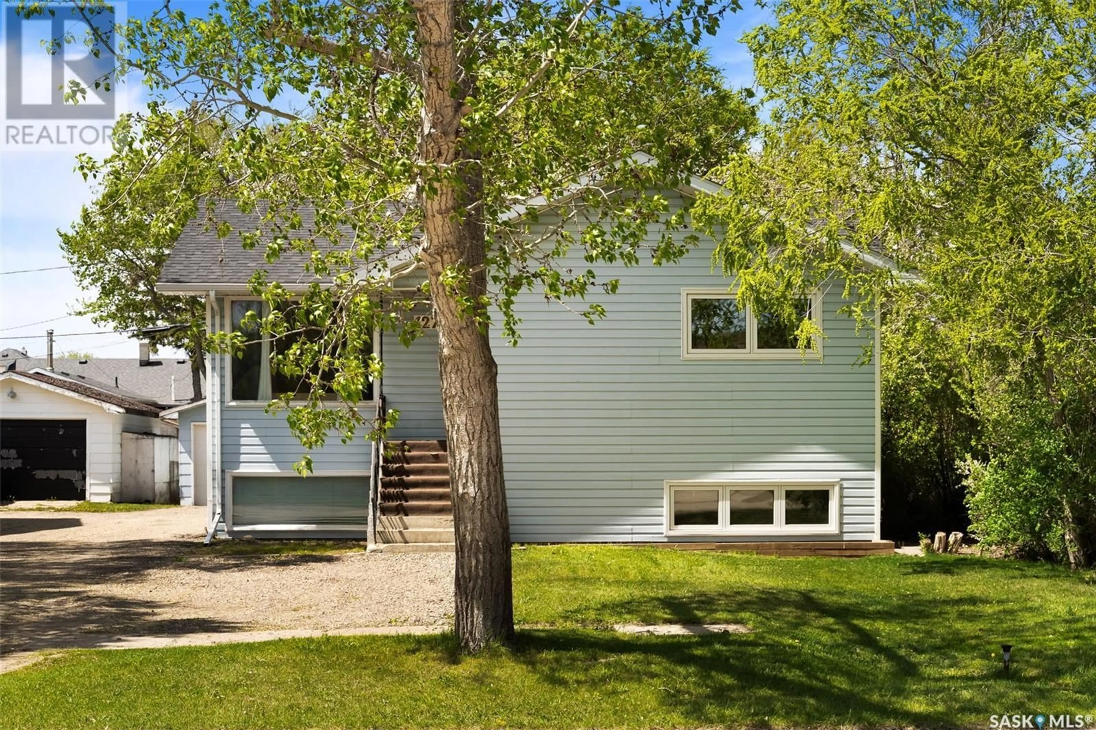 Home with vinyl exterior material, street for 127 QUEEN STREET, Milestone Saskatchewan S0G3L0