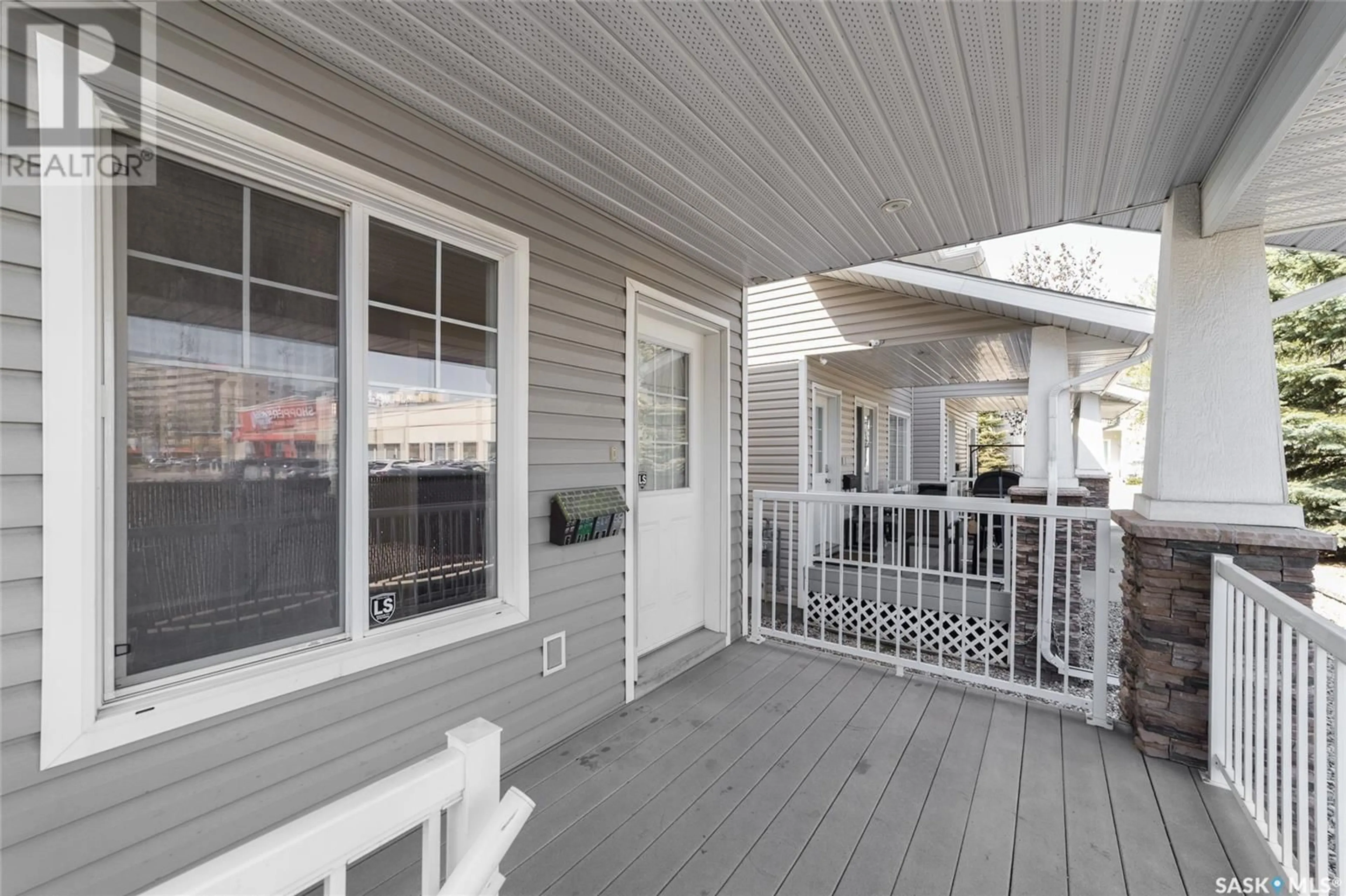 Home with vinyl exterior material, street for 2231 TREETOP LANE, Regina Saskatchewan S4P4V8