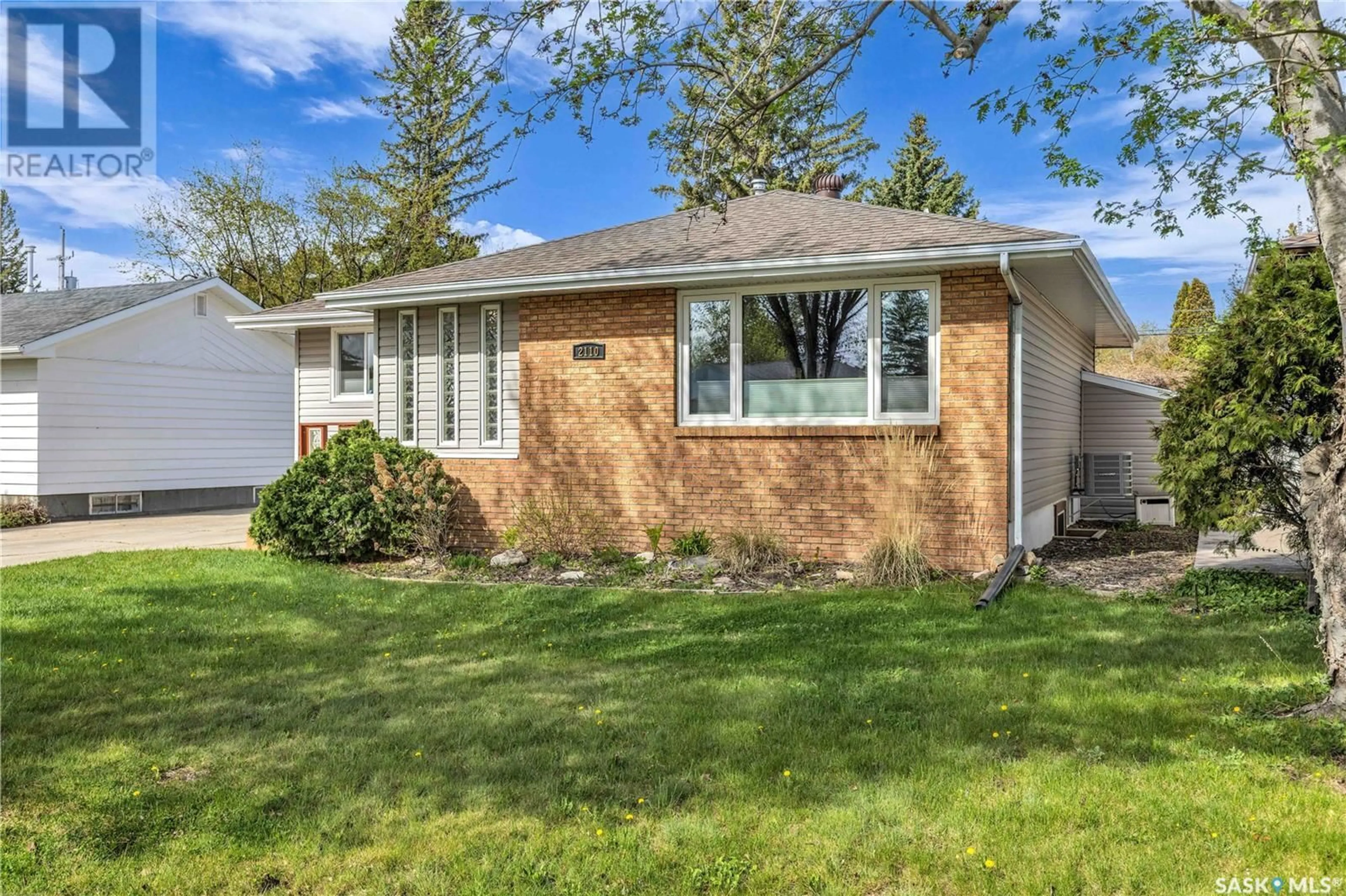 Home with vinyl exterior material, street for 2110 CAIRNS AVENUE, Saskatoon Saskatchewan S7J1T6