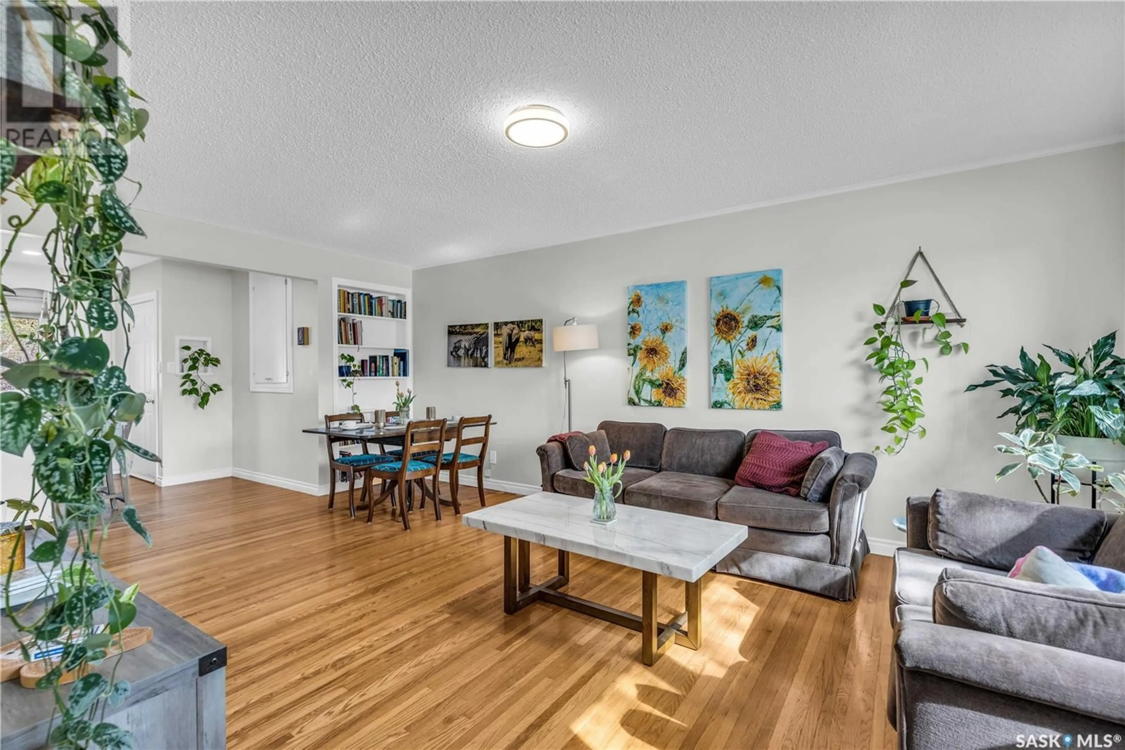 Living room with furniture, wood/laminate floor for 2110 CAIRNS AVENUE, Saskatoon Saskatchewan S7J1T6