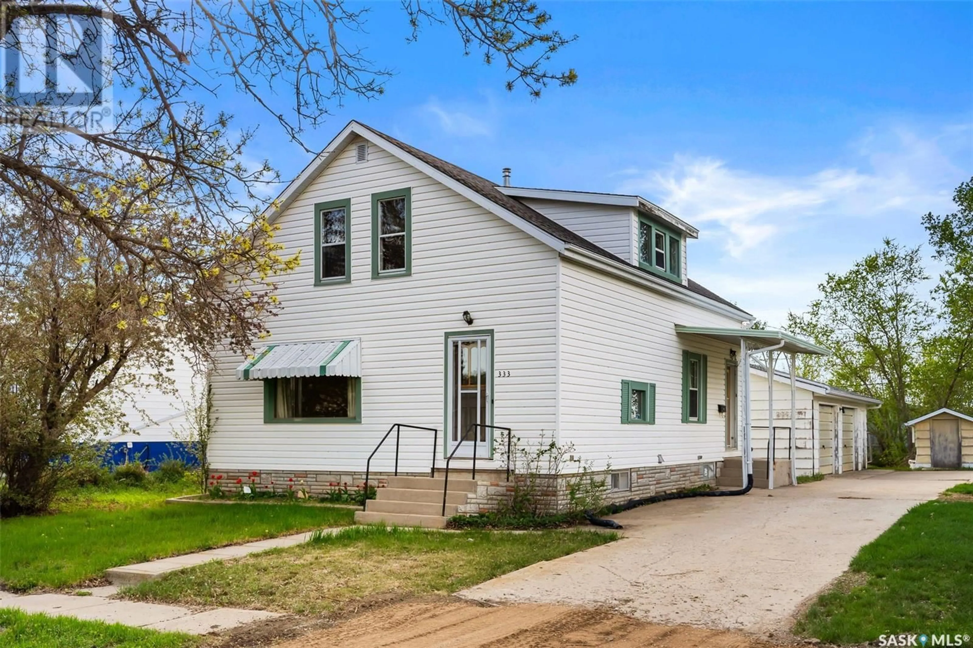 Home with vinyl exterior material, street for 333 MAIN STREET, Milestone Saskatchewan S0G3L0