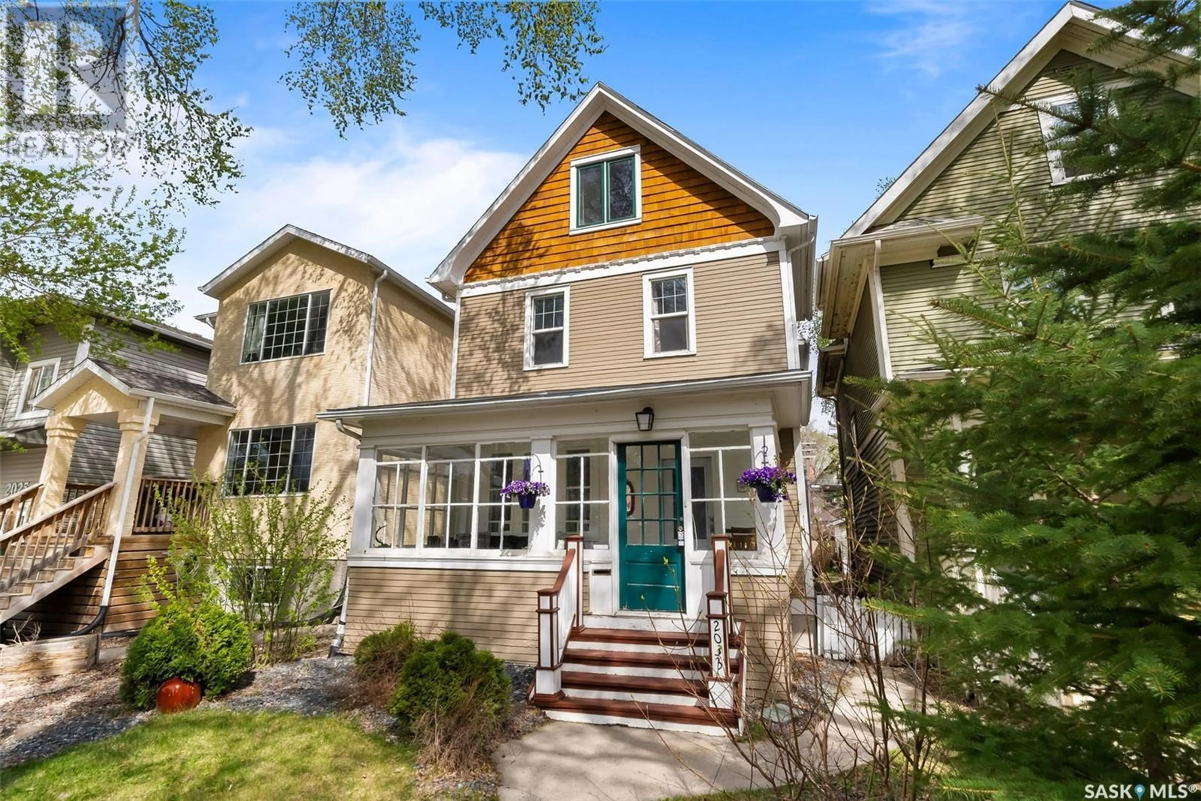 Home with vinyl exterior material, street for 2033 RETALLACK STREET, Regina Saskatchewan S4T2K3