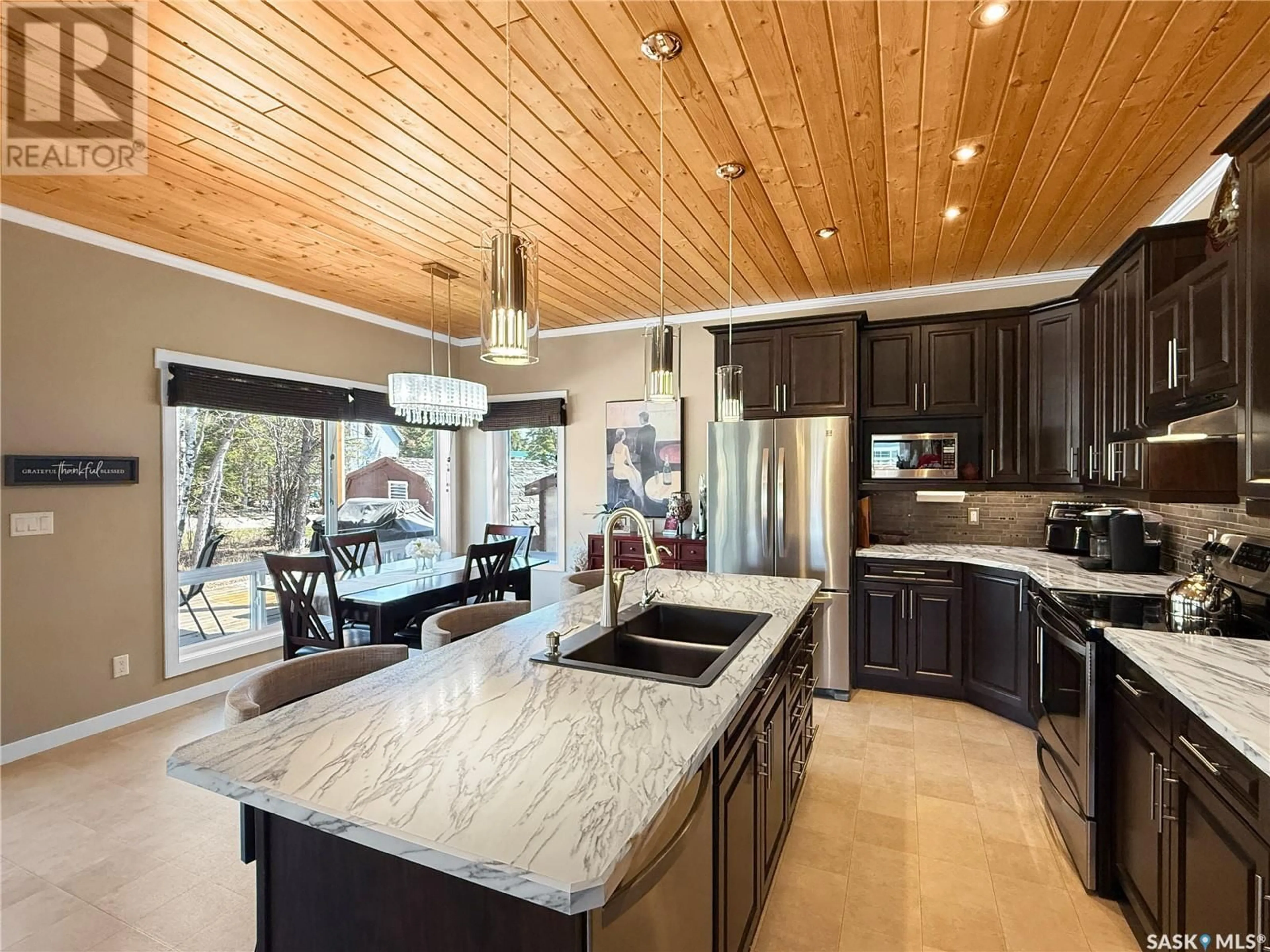 Open concept kitchen, ceramic/tile floor for 3 WHITE POPLAR CRESCENT, Candle Lake Saskatchewan S0J3E0