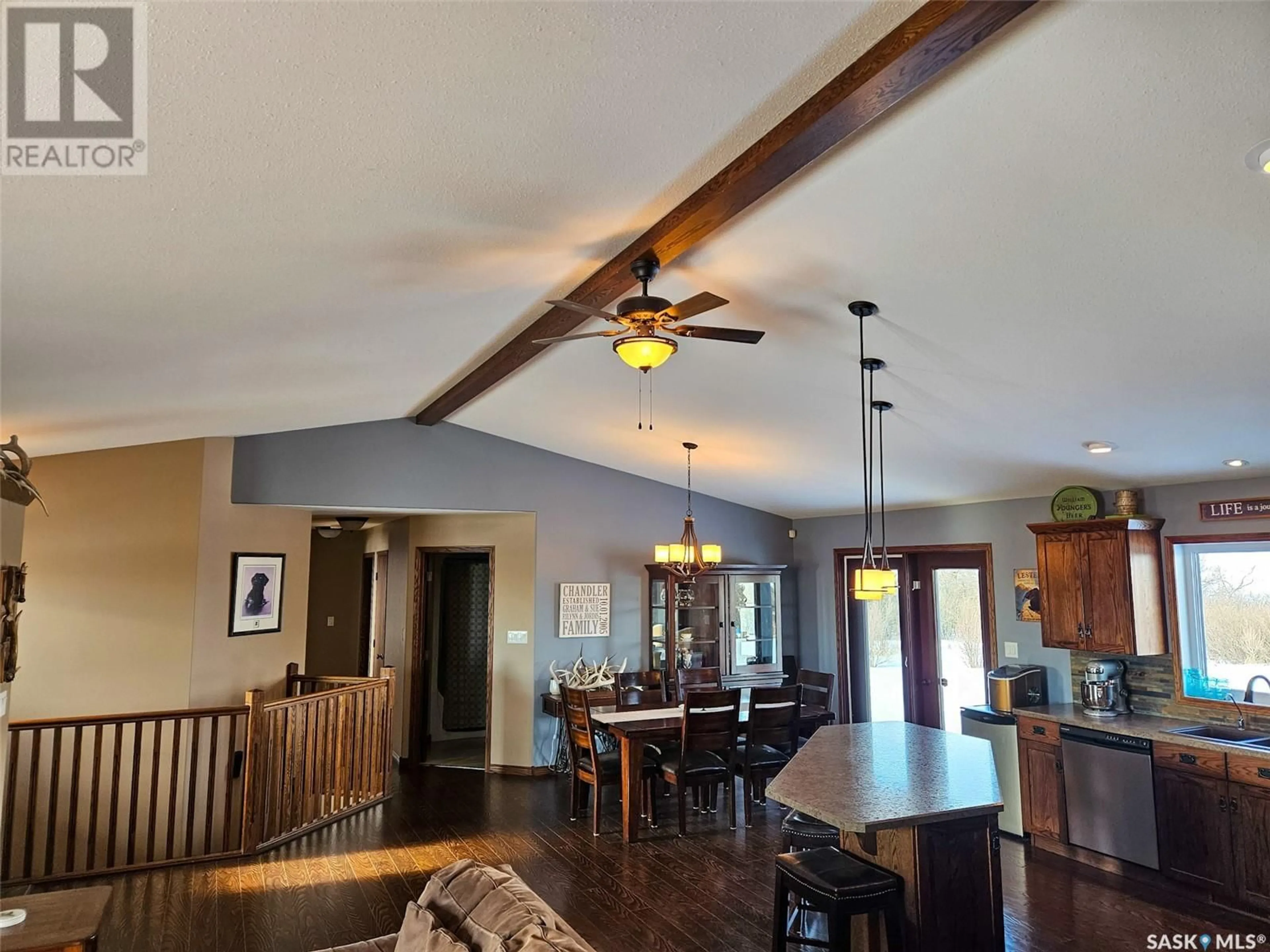Open concept kitchen, wood/laminate floor for CHANDLER ACREAGE, Wood River Rm No. 74 Saskatchewan S0H2K0