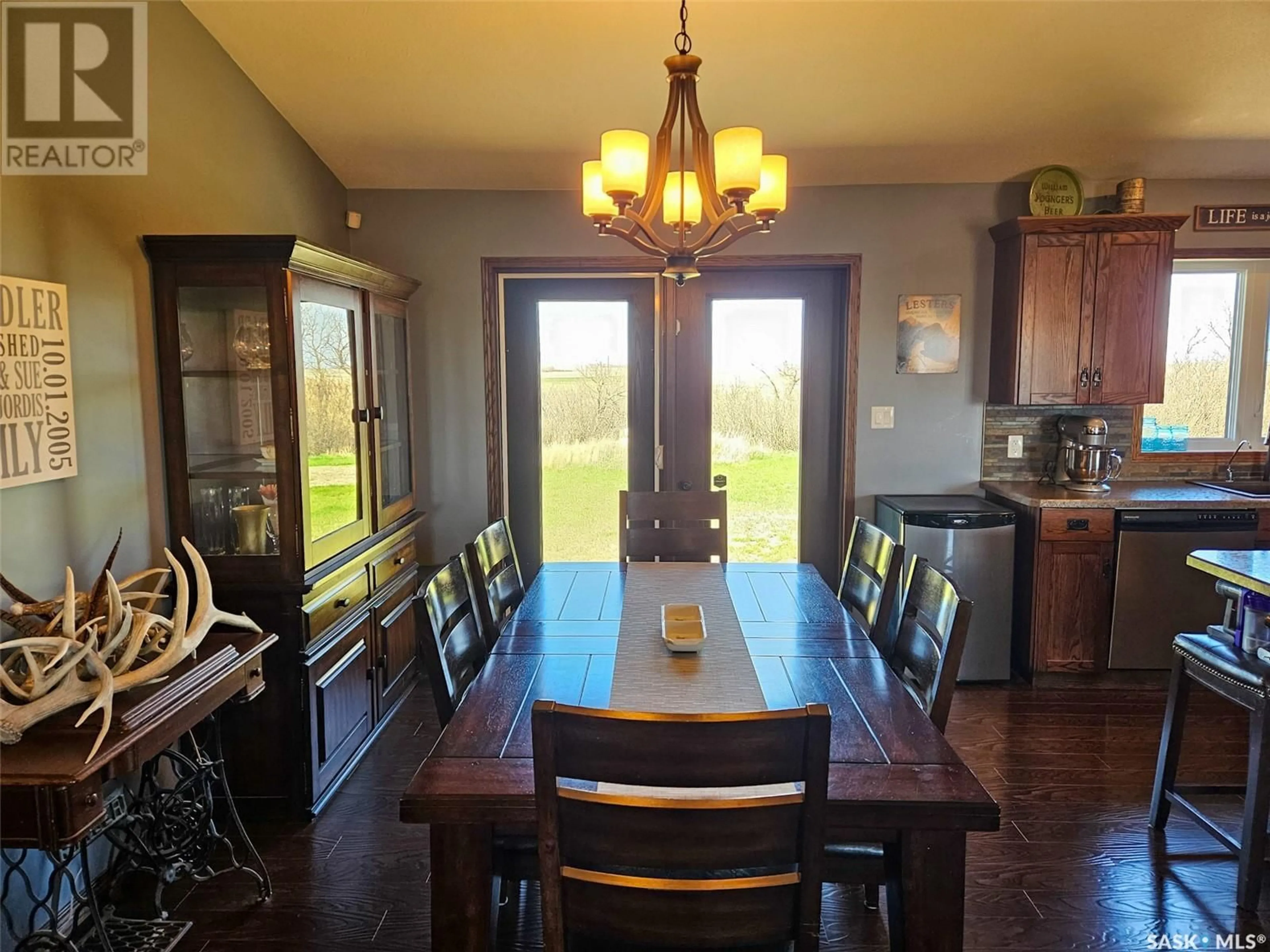 Dining room, wood/laminate floor for CHANDLER ACREAGE, Wood River Rm No. 74 Saskatchewan S0H2K0
