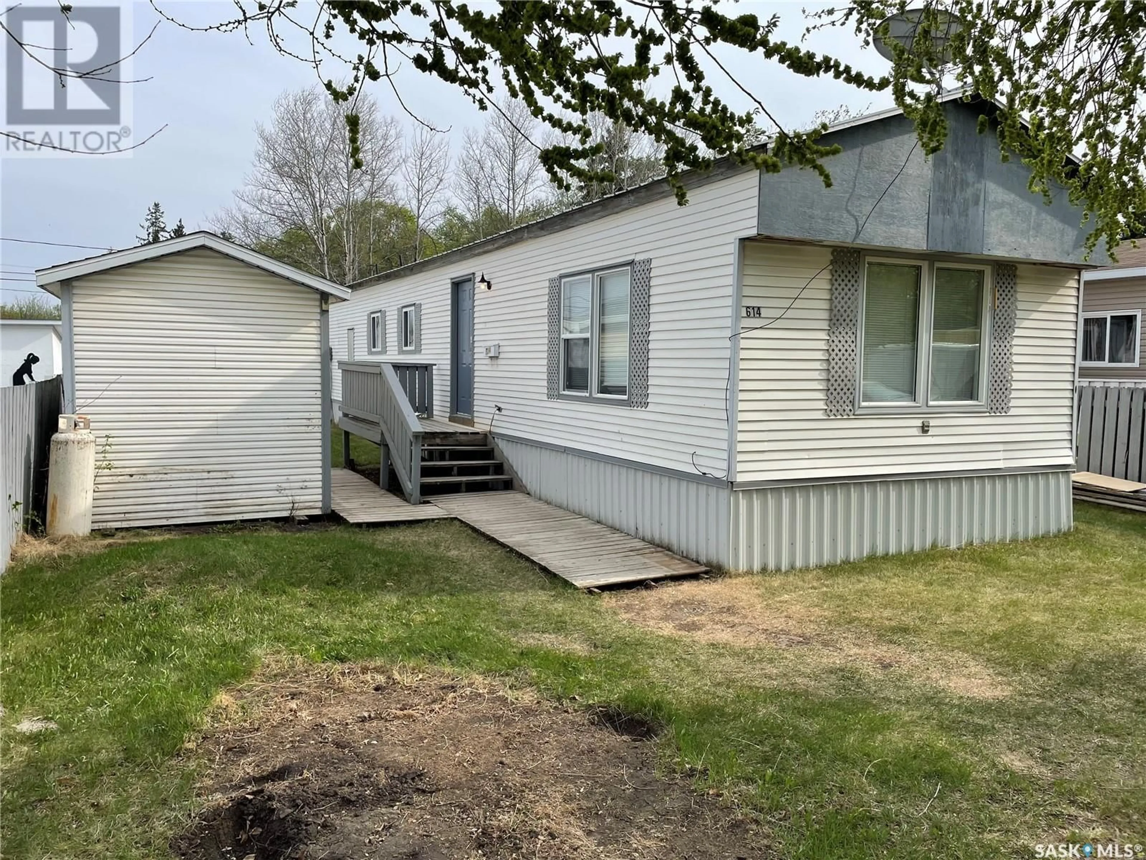Home with vinyl exterior material, street for 614 2ND STREET, Meadow Lake Saskatchewan S9X1H7