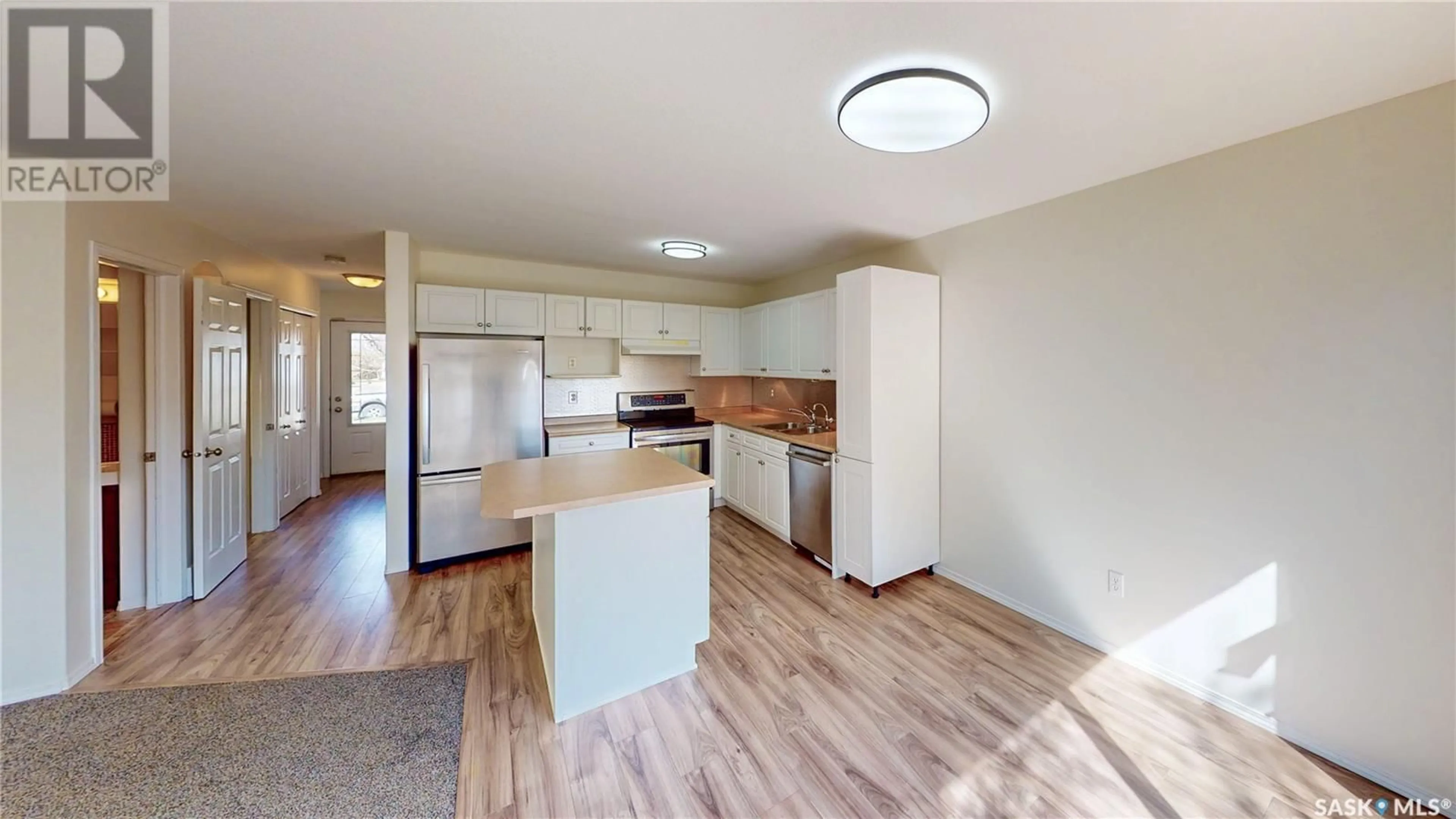 Open concept kitchen, wood/laminate floor for 21 - 4901 CHILD AVENUE, Regina Saskatchewan S4X4T8
