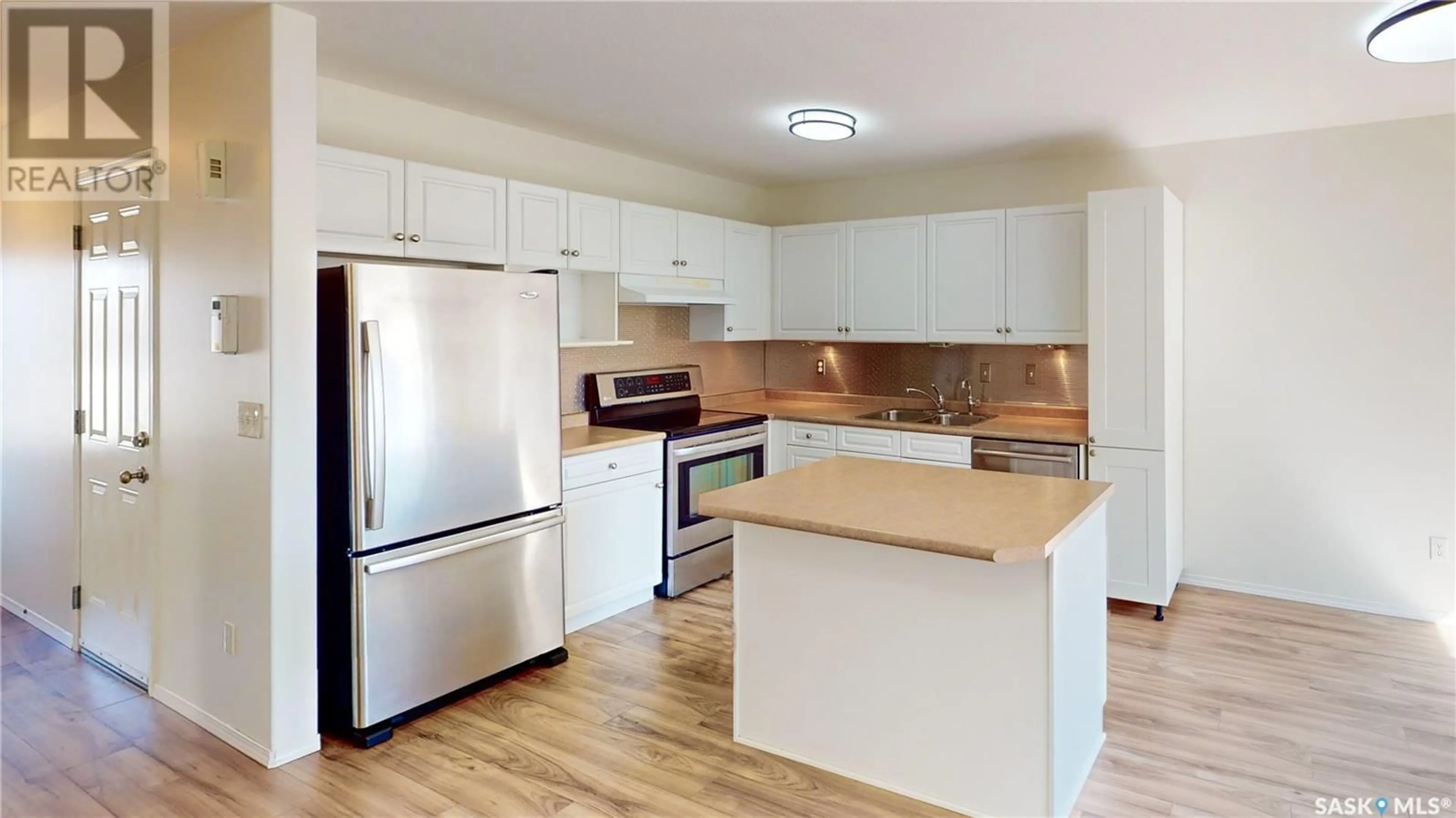 Standard kitchen, wood/laminate floor for 21 - 4901 CHILD AVENUE, Regina Saskatchewan S4X4T8