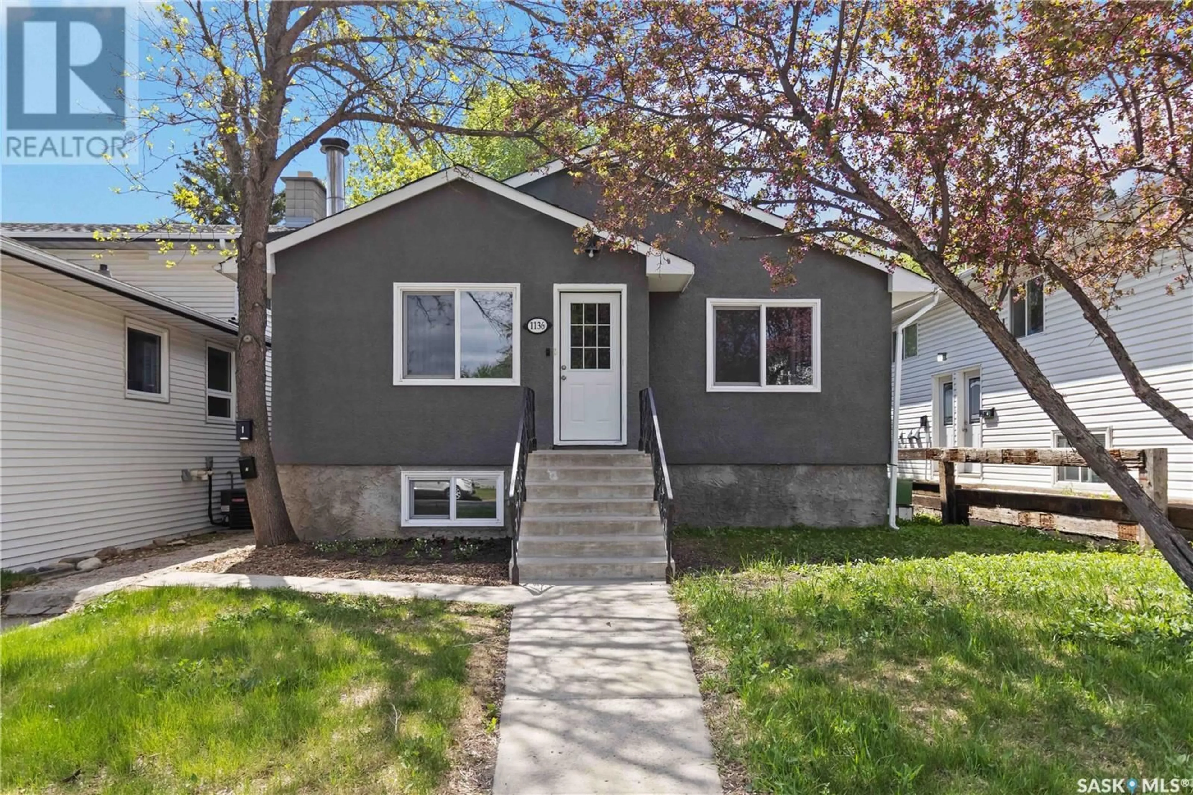 Home with vinyl exterior material, street for 1136 12TH STREET, Saskatoon Saskatchewan S7H0E2