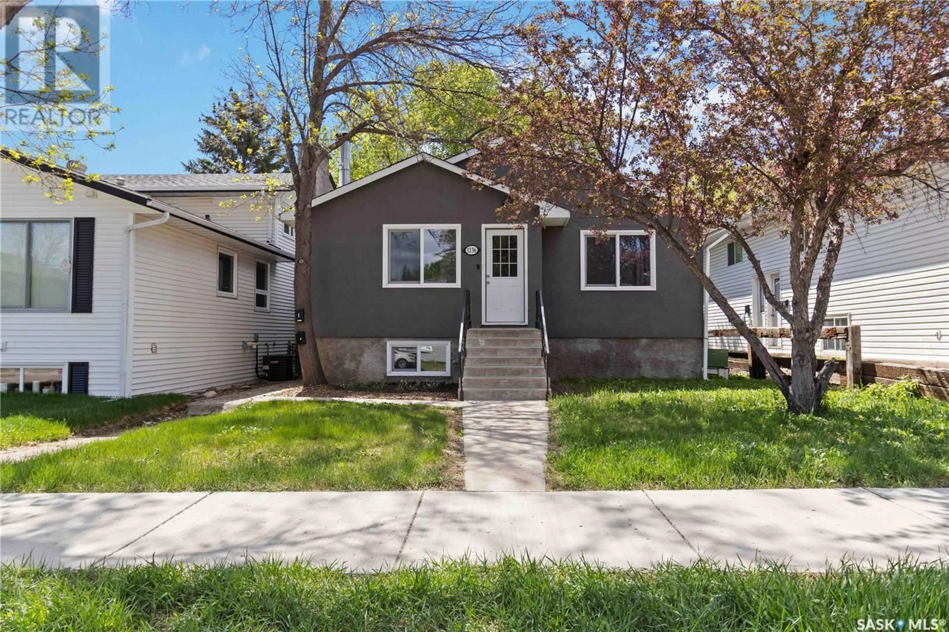 Home with vinyl exterior material, street for 1136 12TH STREET, Saskatoon Saskatchewan S7H0E2