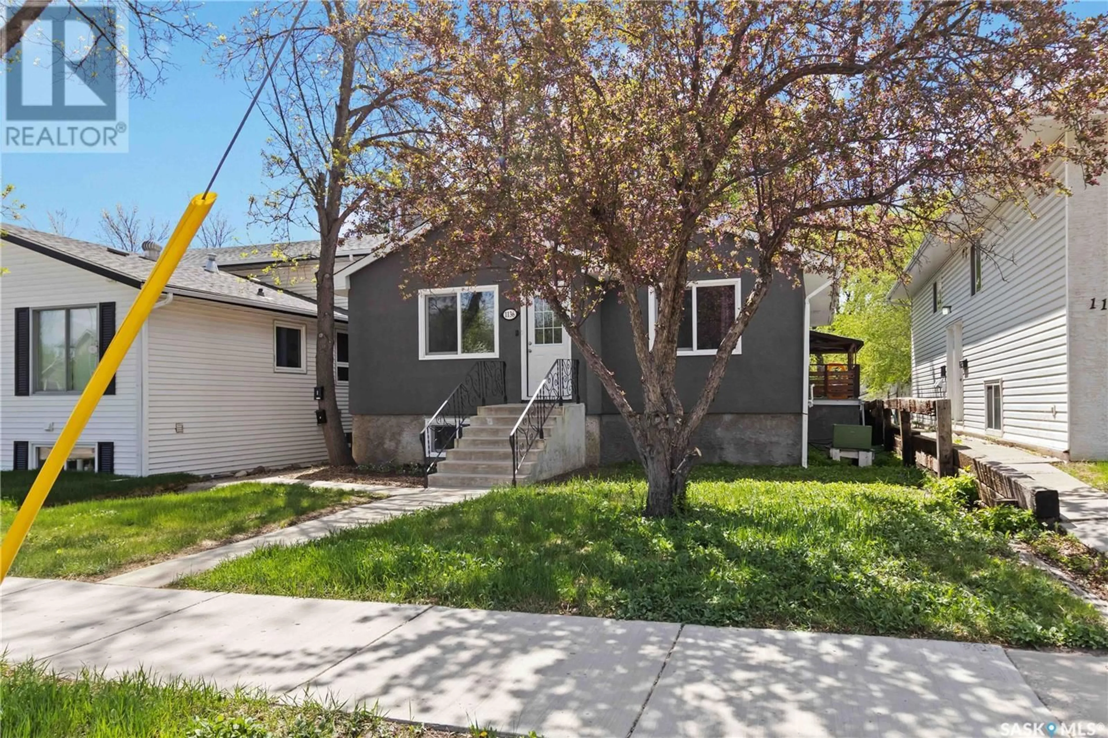 Home with vinyl exterior material, street for 1136 12TH STREET, Saskatoon Saskatchewan S7H0E2