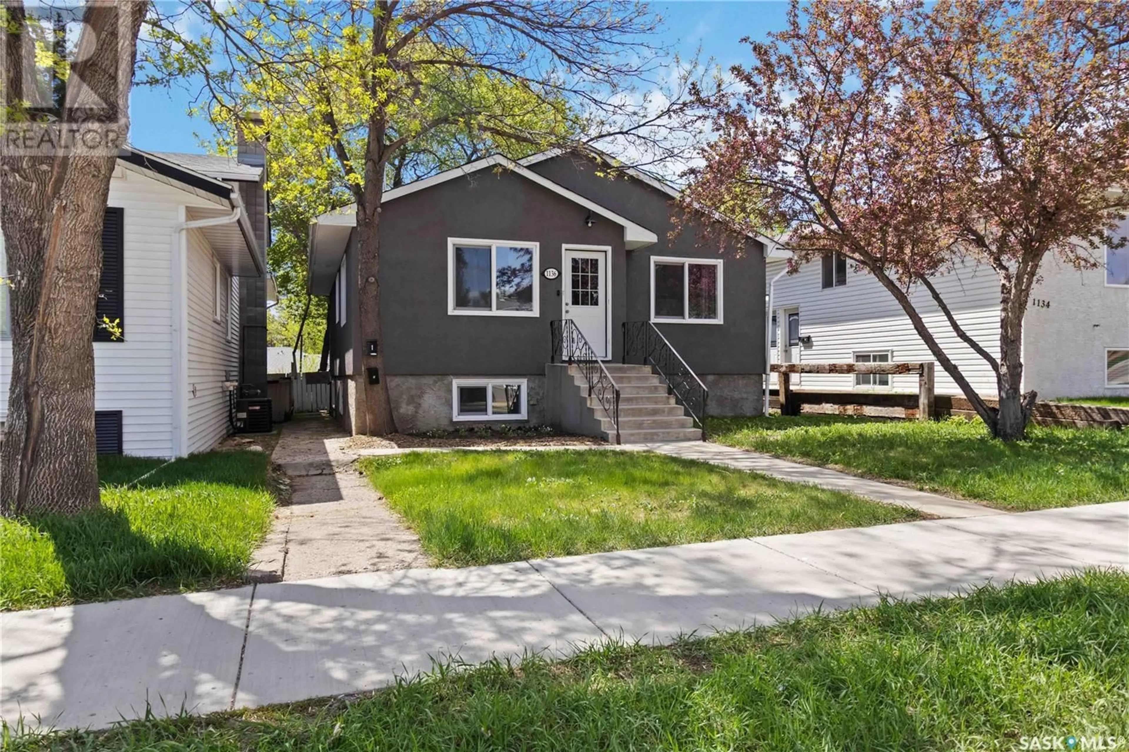 Home with vinyl exterior material, street for 1136 12TH STREET, Saskatoon Saskatchewan S7H0E2