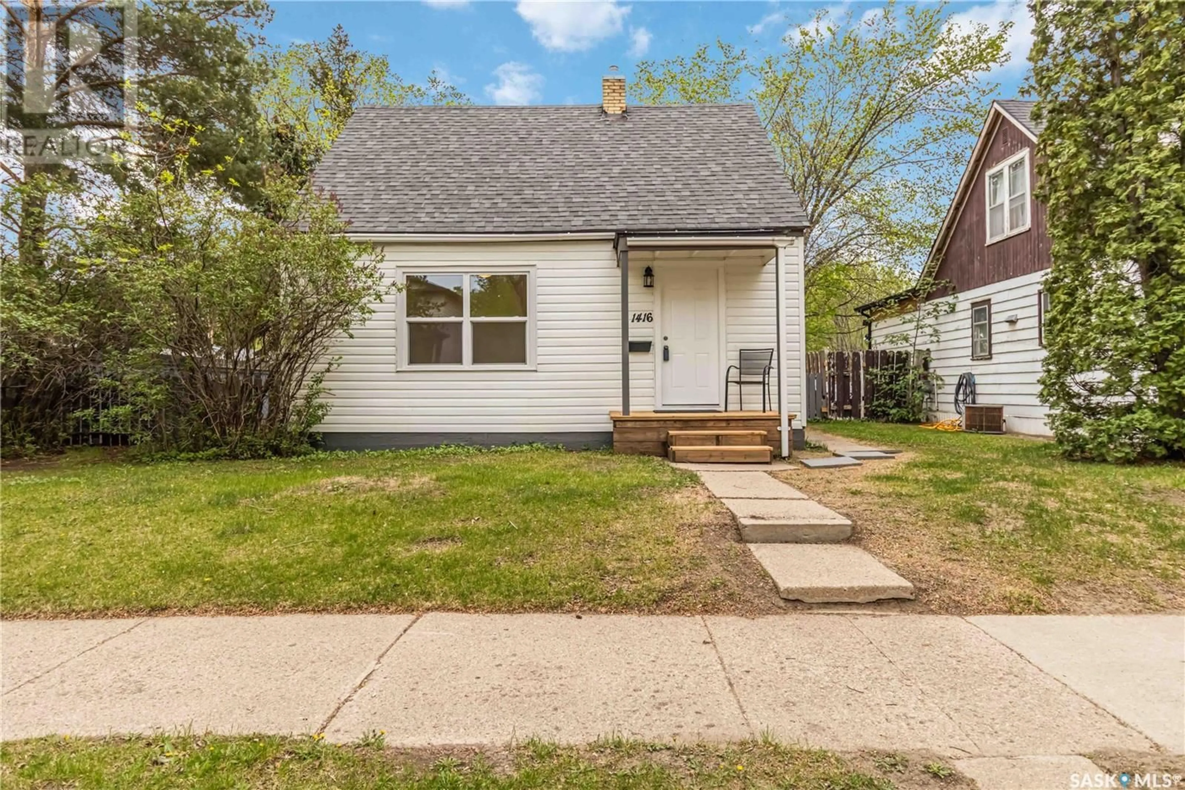 Home with vinyl exterior material, street for 1416 C AVENUE, Saskatoon Saskatchewan S7L1L1