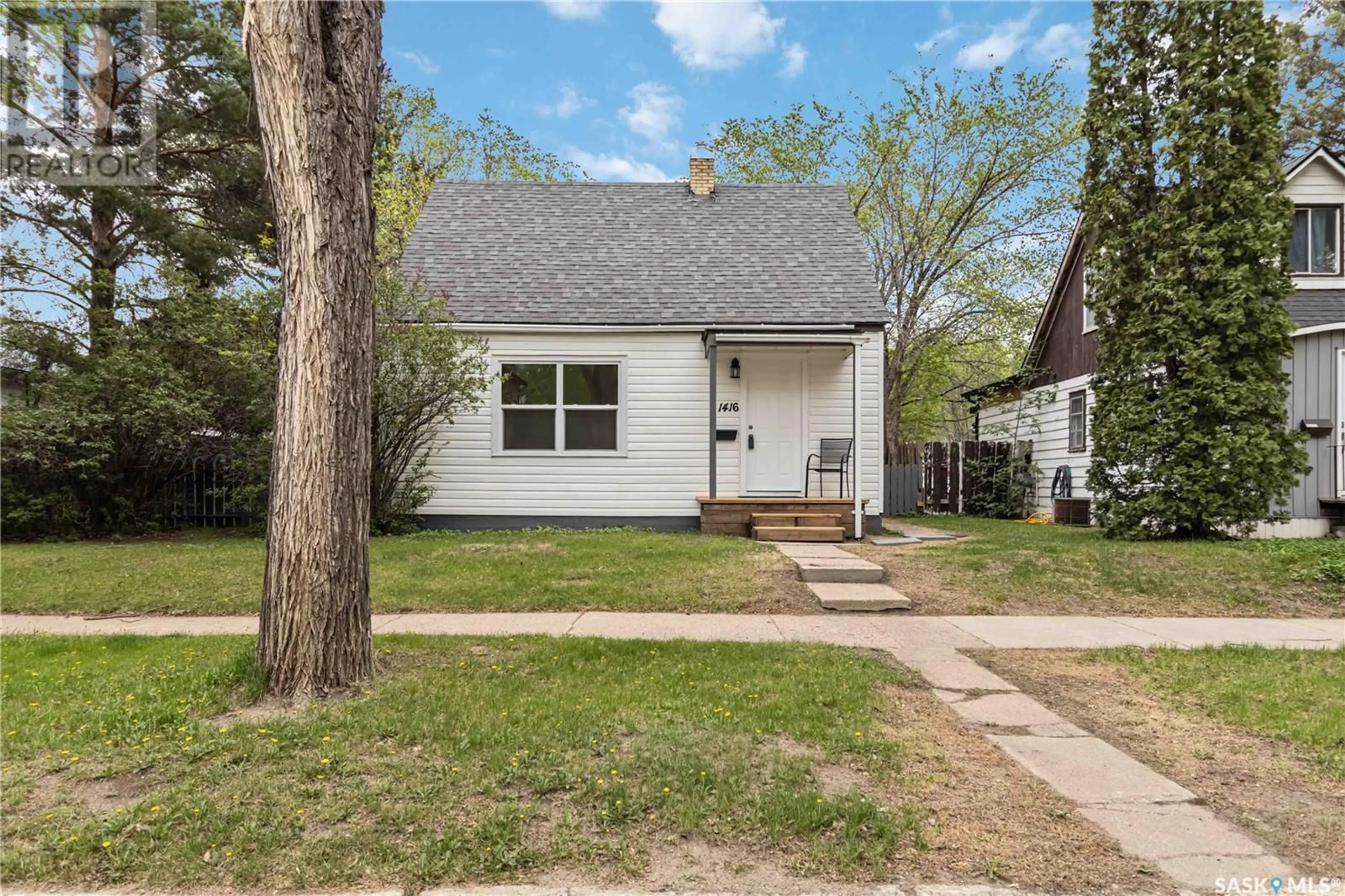 Home with vinyl exterior material, street for 1416 C AVENUE, Saskatoon Saskatchewan S7L1L1