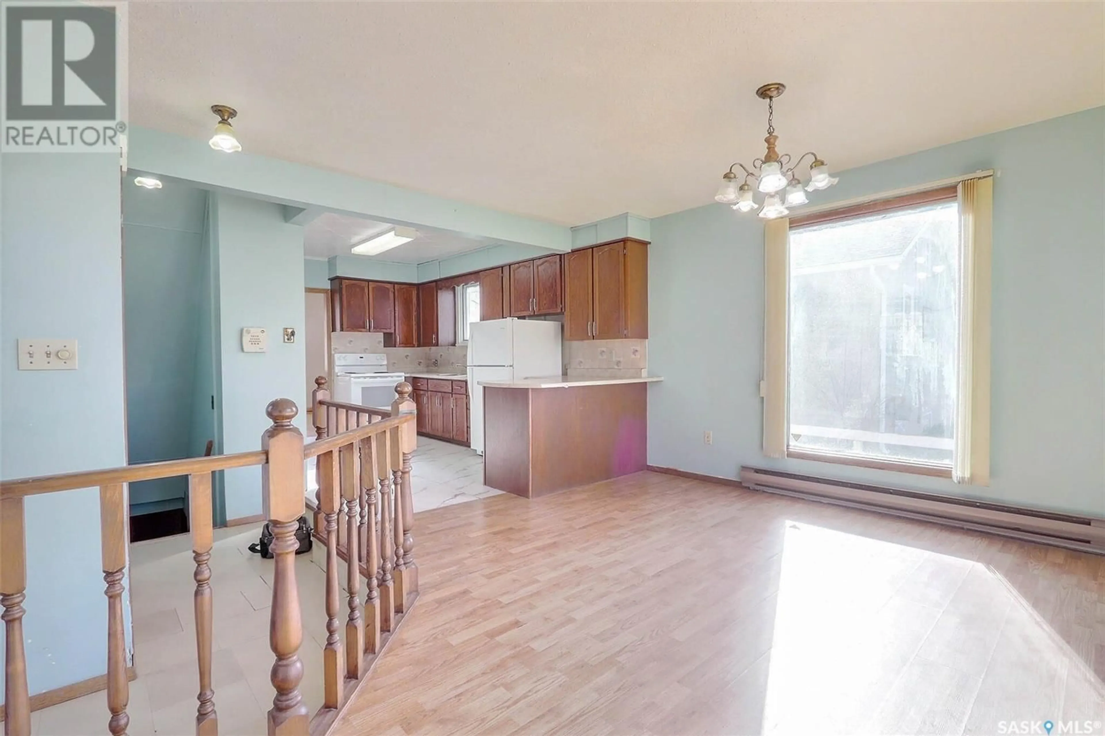 Open concept kitchen, wood/laminate floor for 784 4TH STREET, Prince Albert Saskatchewan S6V0K3