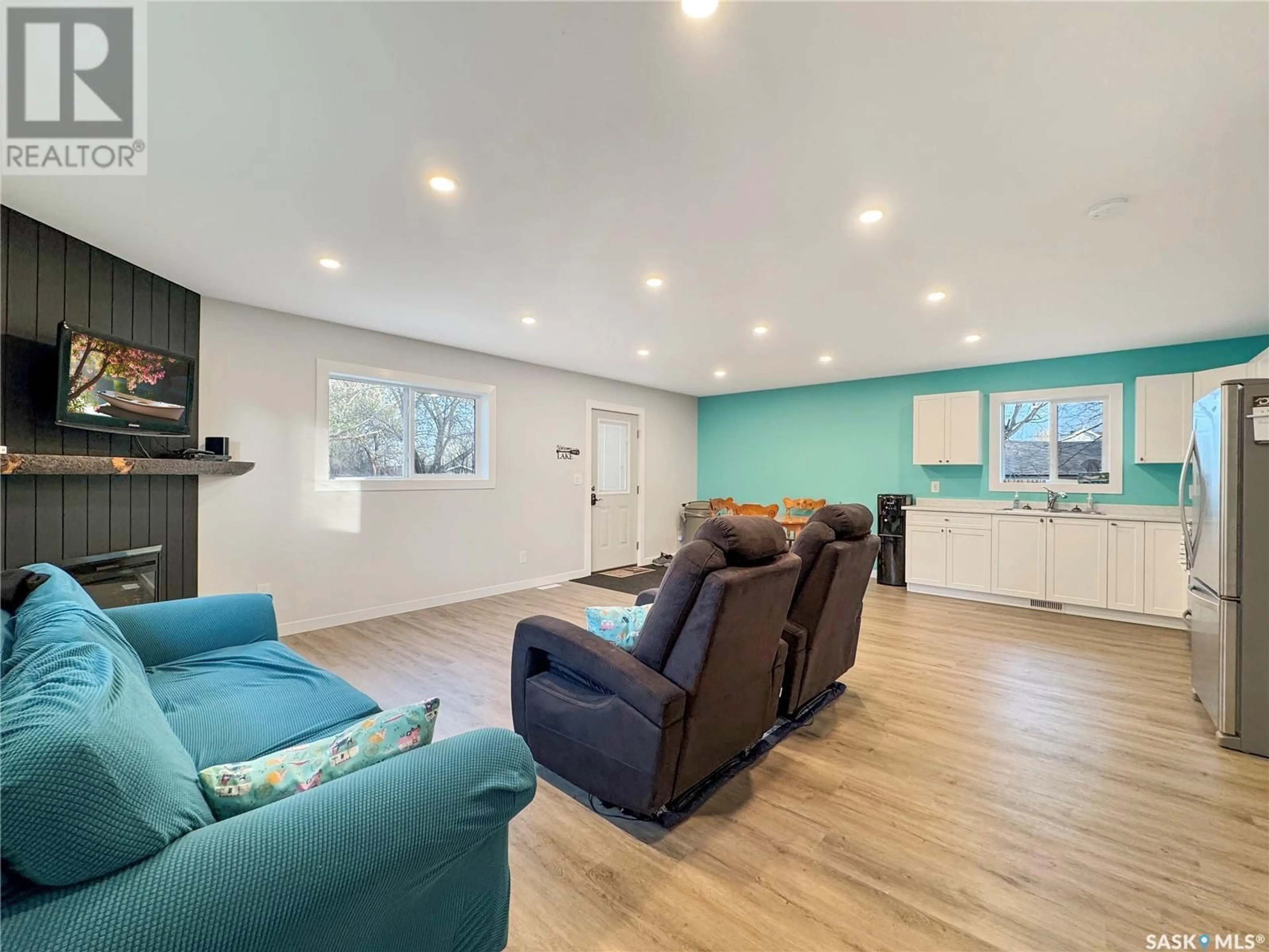 Living room with furniture, wood/laminate floor for 972 ALFRED CRESCENT, Cochin Saskatchewan S0M0L0
