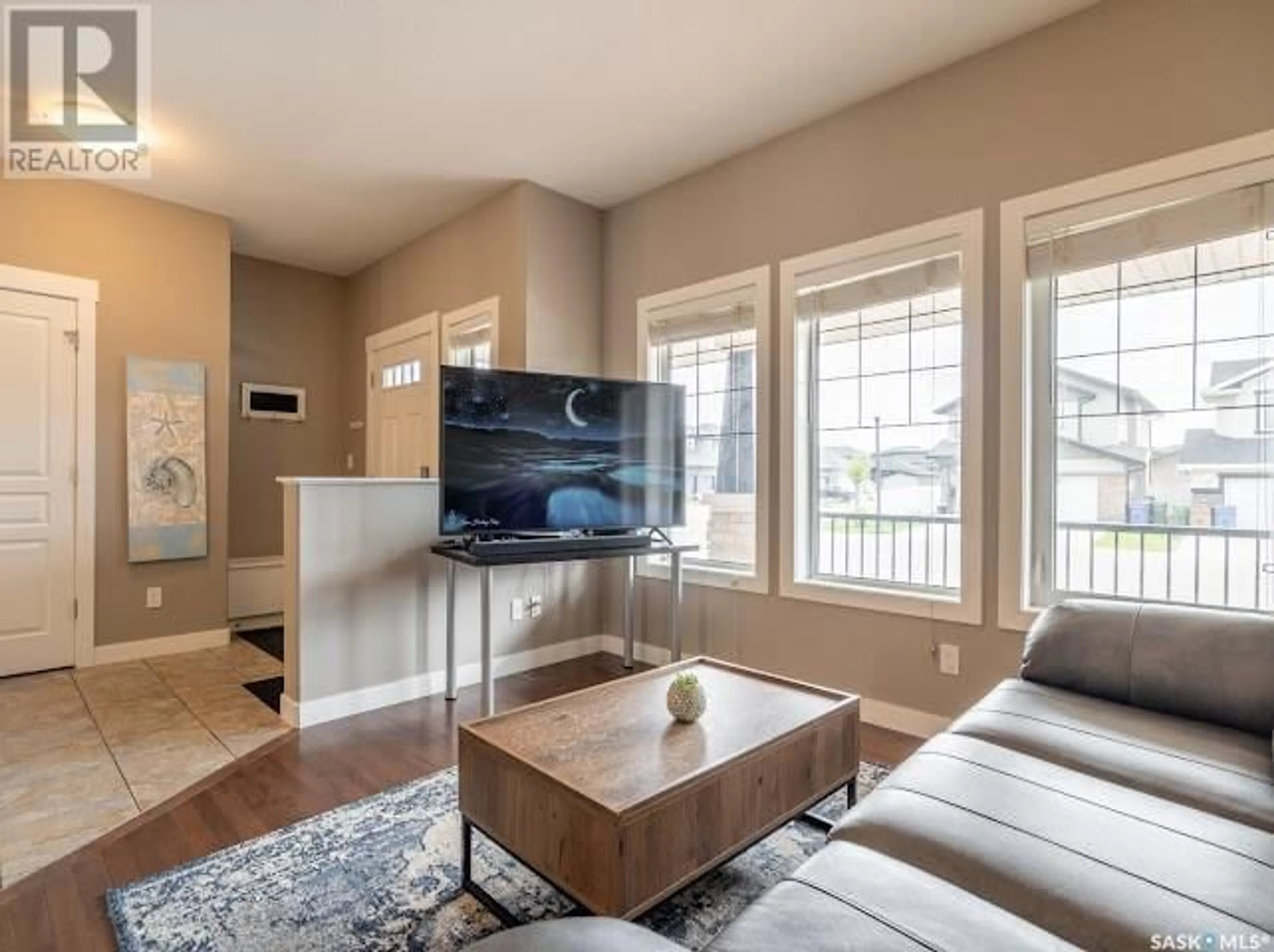 Living room with furniture, wood/laminate floor for 3529 GREEN BANK ROAD, Regina Saskatchewan S4V1L5