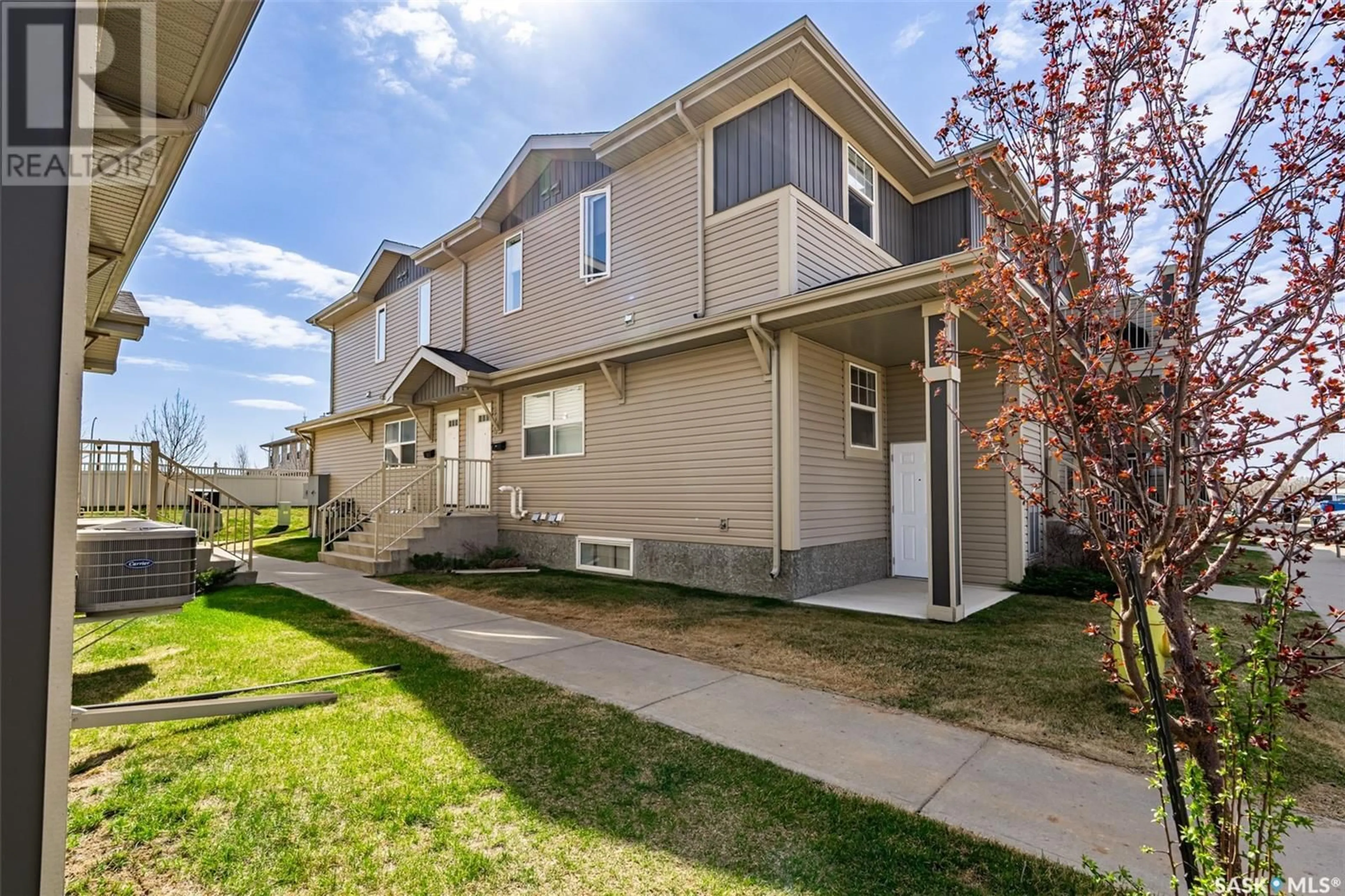 Home with vinyl exterior material, street for 100 - 215 CHAPARRAL BOULEVARD, Martensville Saskatchewan S0K2T2