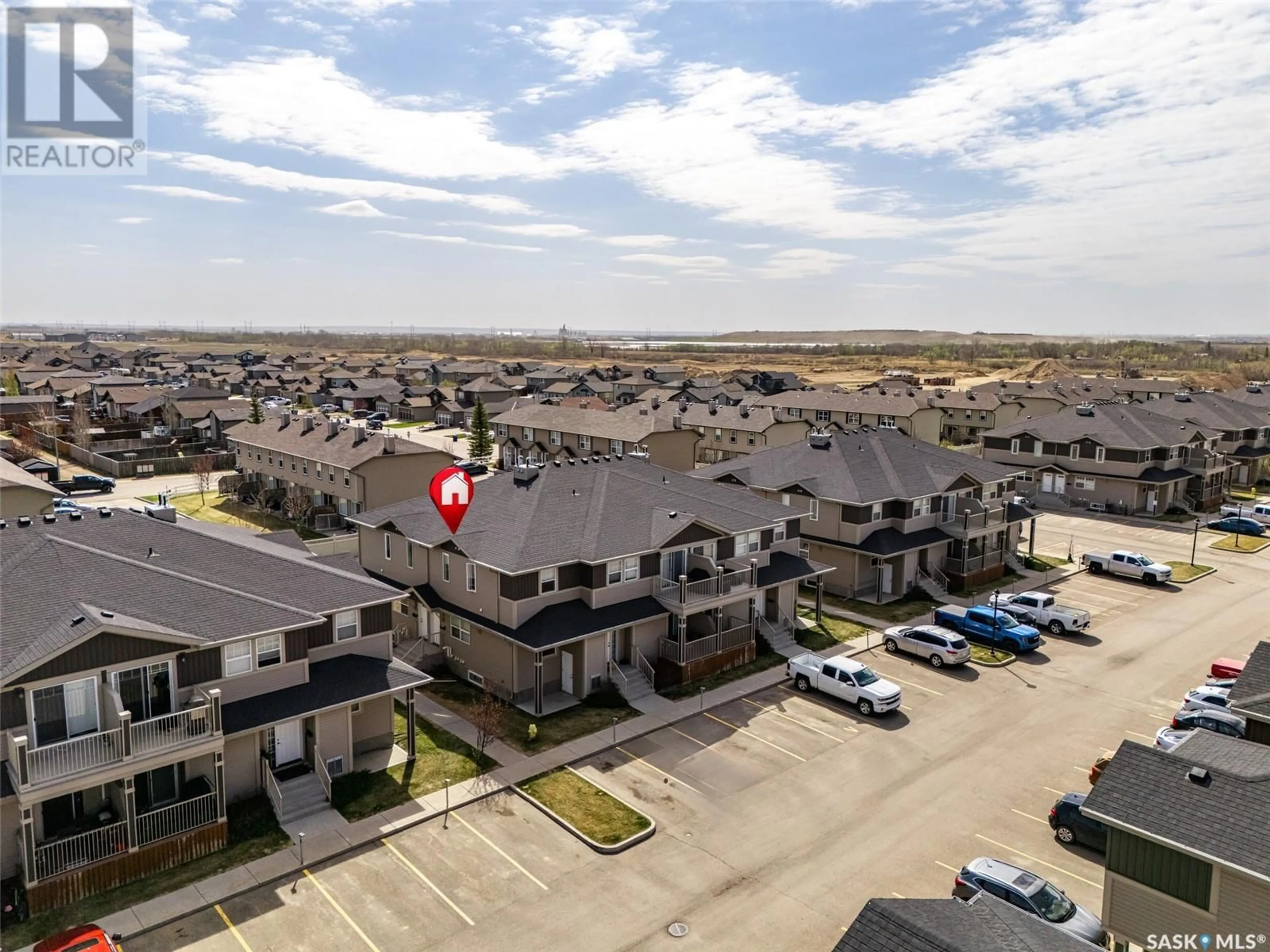 A pic from outside/outdoor area/front of a property/back of a property/a pic from drone, street for 100 - 215 CHAPARRAL BOULEVARD, Martensville Saskatchewan S0K2T2