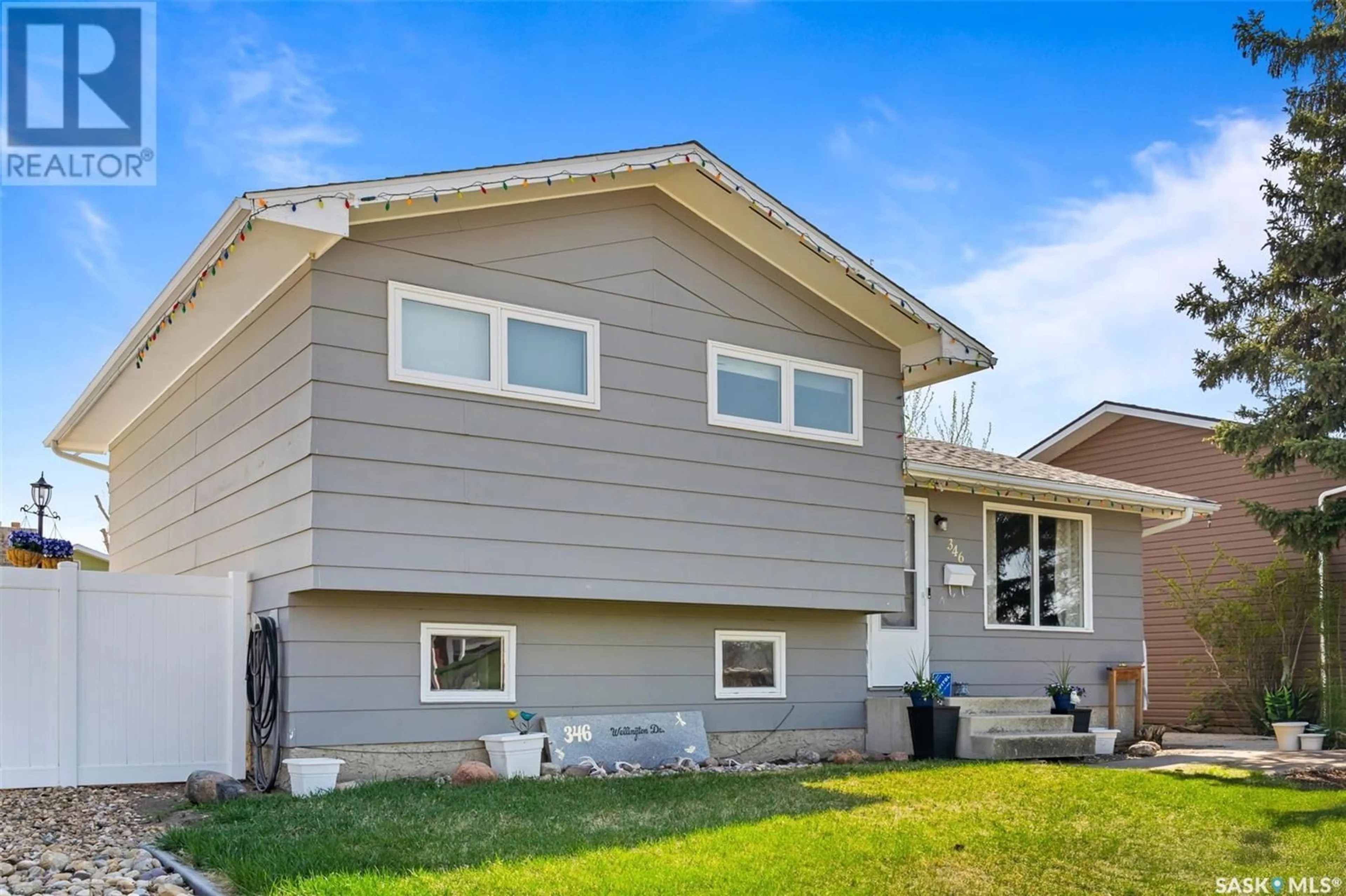 Home with vinyl exterior material, street for 346 WELLINGTON DRIVE, Moose Jaw Saskatchewan S6K1A4