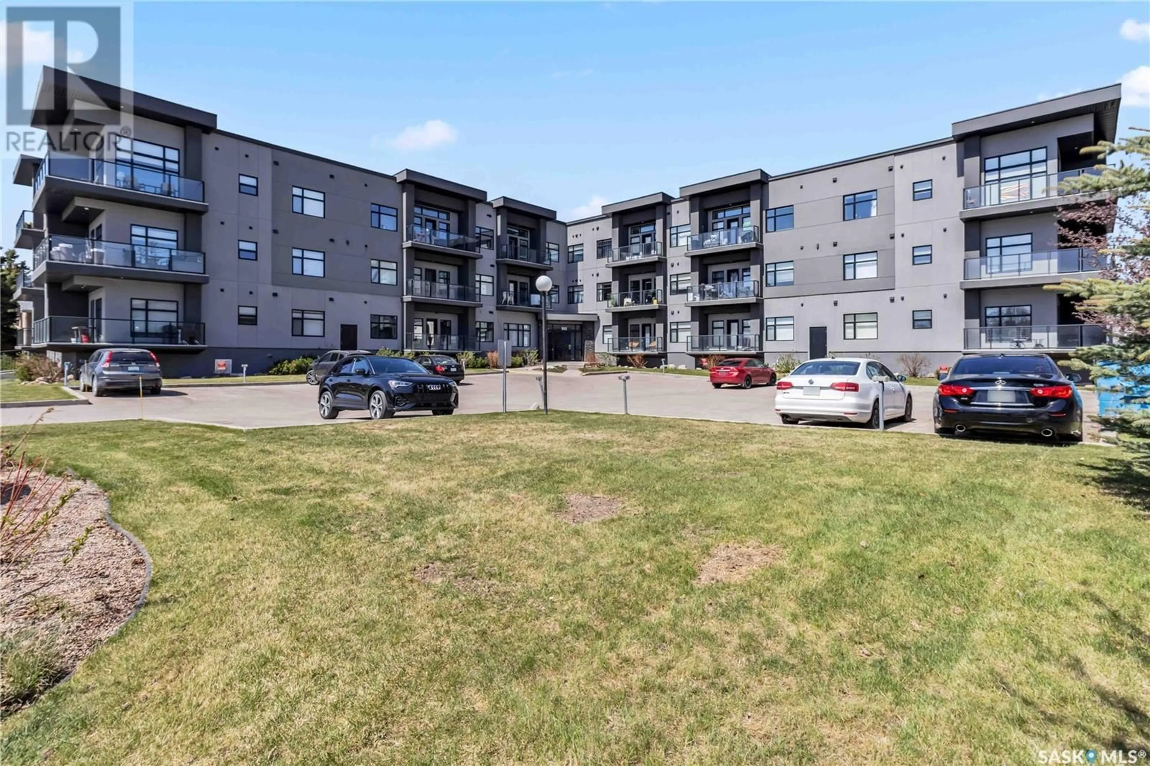 A pic from outside/outdoor area/front of a property/back of a property/a pic from drone, unknown for 502 - 215 PEREHUDOFF CRESCENT, Saskatoon Saskatchewan S7N4H6