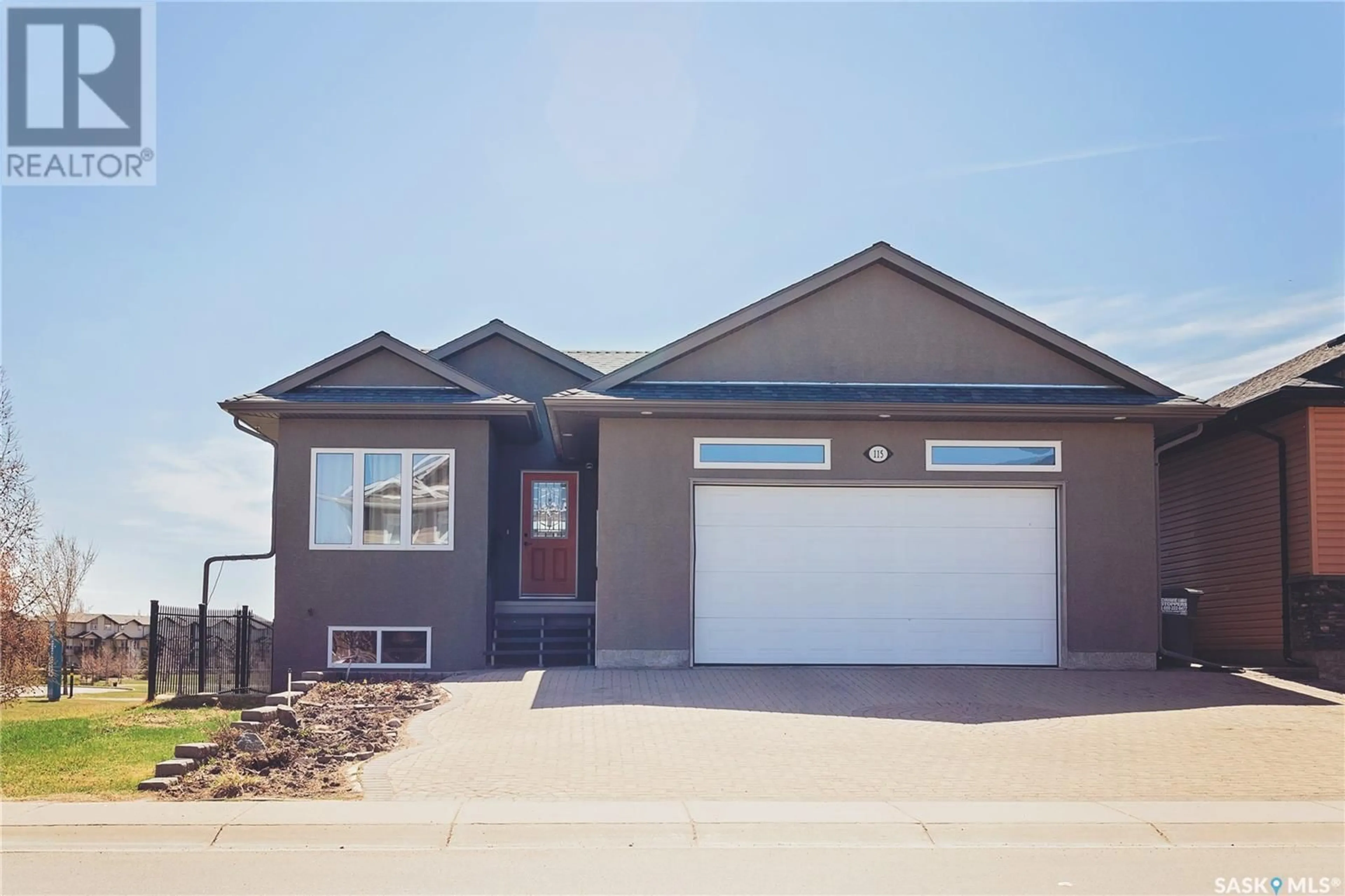 Home with vinyl exterior material, street for 115 WEST HAMPTON BOULEVARD, Saskatoon Saskatchewan S7R0B7