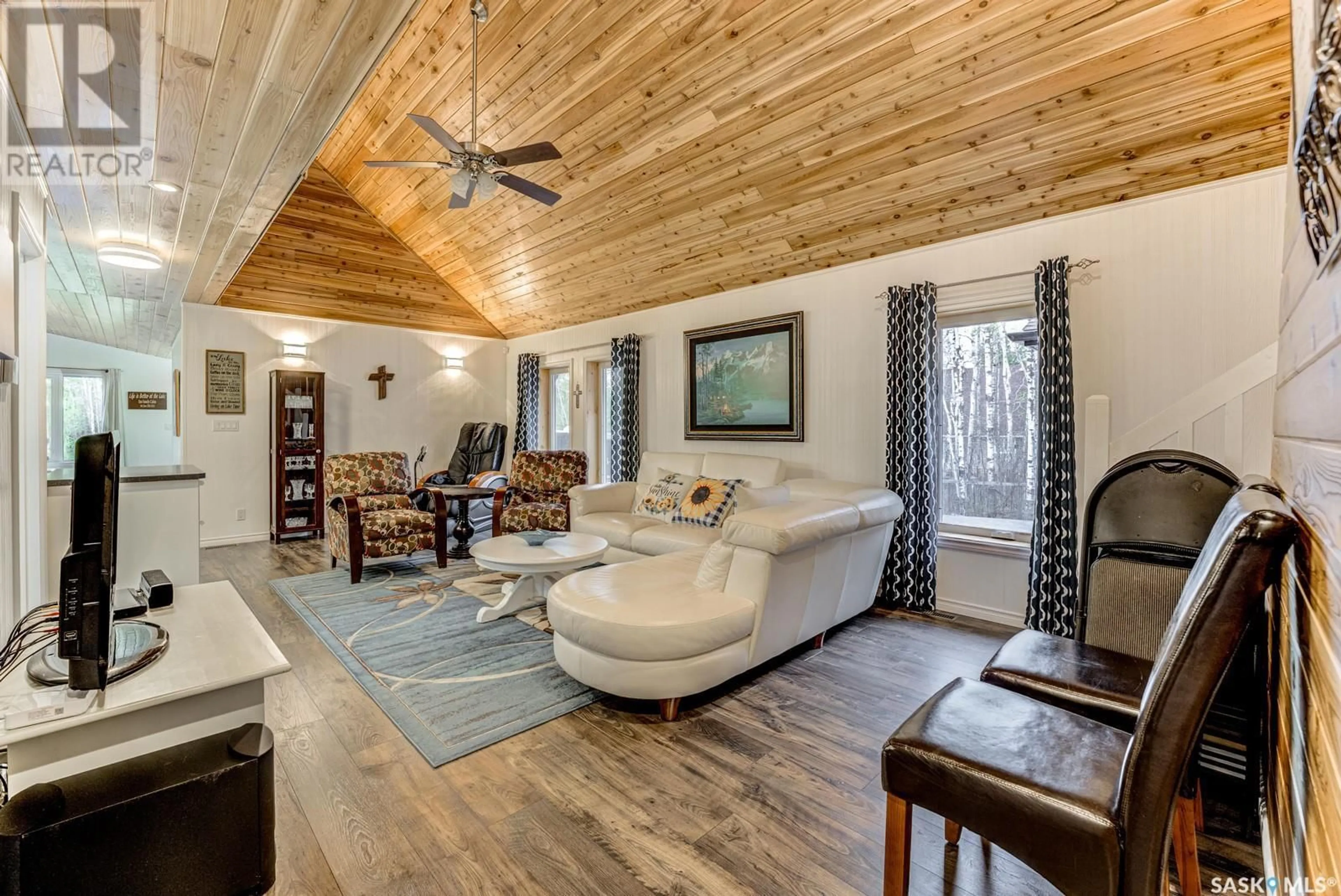 Living room with furniture, wood/laminate floor for 303A LAC DES ILES ROAD, Lac Des Iles Saskatchewan S0M1A0